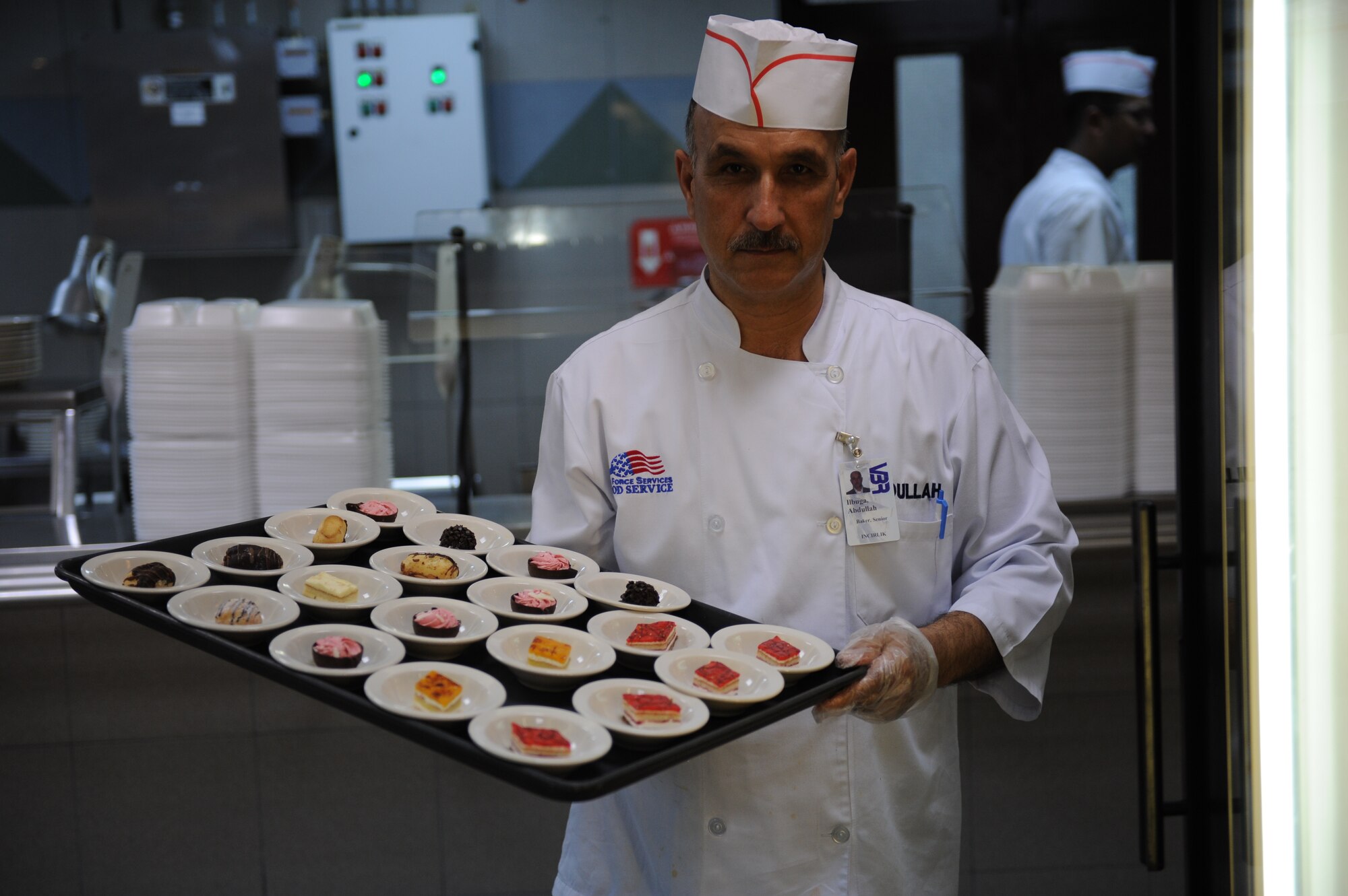 Abdullah Ilbuga, 39th Force Support Squadron senior baker, puts desserts away in preparation for lunch July 27, 2012,  at the Sultan's Inn Dining Facility at Incirlik Air Base, Turkey. The dining facility has received the John L. Hennessy Award, Single Unit Category, twice in the past three years at the Air Force level. (U.S. Air Force photo by Senior Airman William A. O'Brien/Released) 