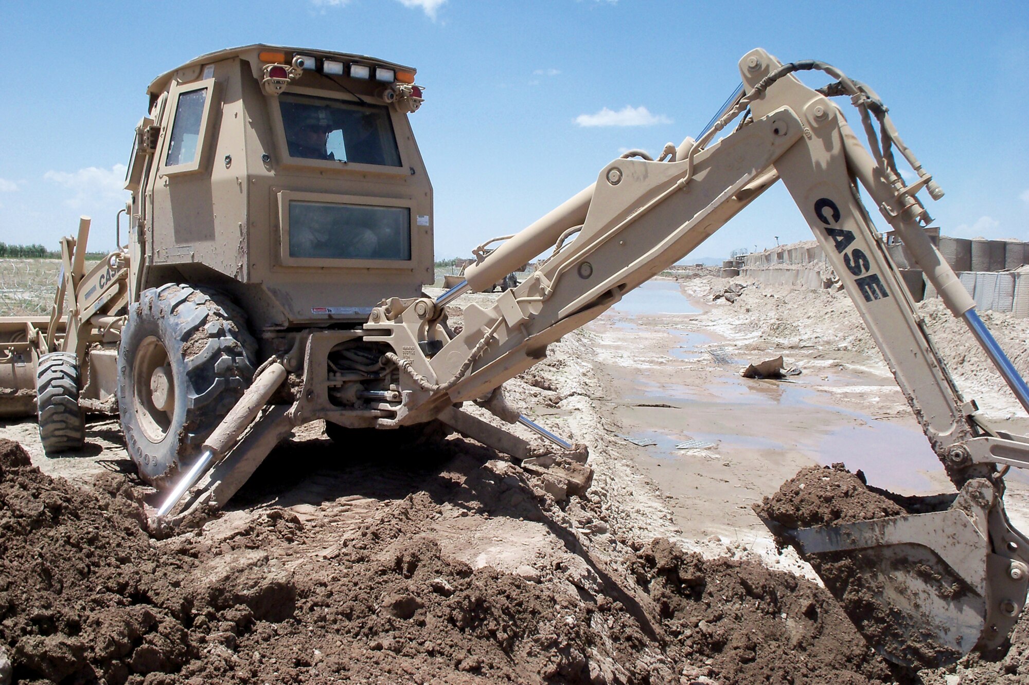 GRISSOM AIR RESERVE BASE, Ind. -- Senior Master Sgt. Nathan Colborn, 434th Civil Engineer Squadron heavy repair superintendent, operates a backhoe during his recent deployment to Afghanistan. For his accomplishments on the front lines, Colborn was named the 2011 Air Force Outstanding Civil Engineer Manager of the Year in the senior NCO category. (U.S. Air Force photo)
