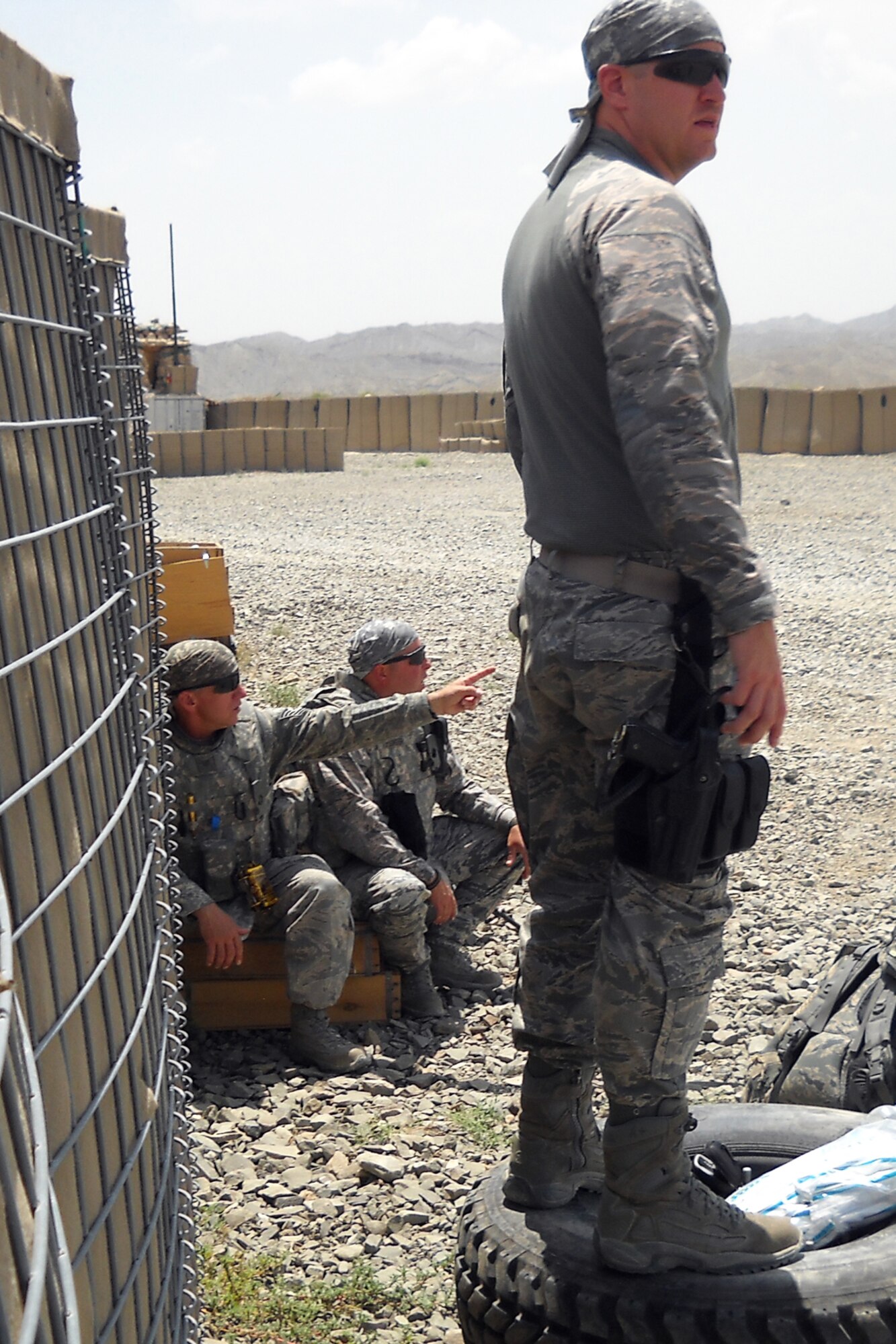 GRISSOM AIR RESERVE BASE, Ind. -- Chief Master Sgt. Michael L. Bowden Jr., and other civil engineers look for an approaching helicopter during a recent deployment to Afghanistan. Bowden, who is the 434th Civil Engineer Squadron manager, was named the 2011 Society of American Military Engineers Goddard Medal recipient at both the Air Force Reserve and Air Force levels. (U.S. Air Force photo)
