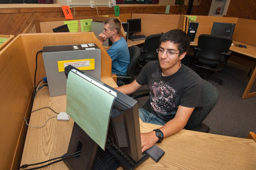 HANSCOM AIR FORCE BASE, Mass. – Dan Ben-Ezra (left) and Ryan Williams, both summer hires, use computers in the old base library July 27. Computer access is still available Monday through Friday from 11 a.m. to 5 p.m. in the facility as part of a new Learning Resource Center model. (U.S. Air Force photo by Rick Berry)