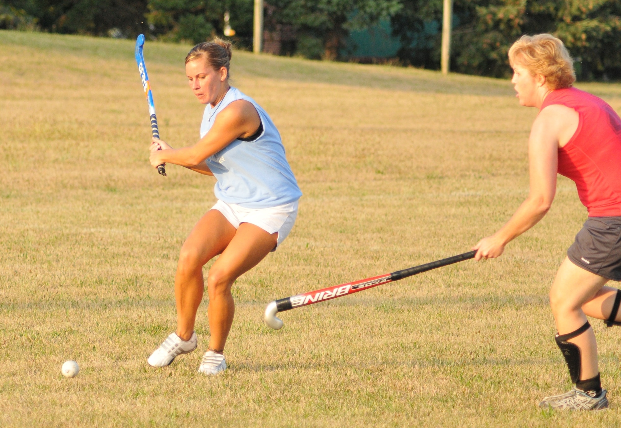 Kate Blanchfield drives a ball toward the goal during her team's July 22, 2012, win in a Dover, Del., adult field hockey league. The 512th Airlift Wing technical sergeant  has played the sport for 15 years. (U.S. Air Force photo by Chief Master Sgt. Matt Proietti)