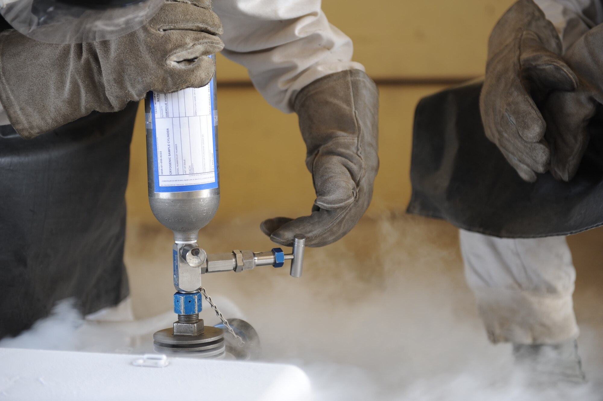 Staff Sgt. Alvaro Usueta, 39th Logistics Readiness Squadron hydrant supervisor, left, performs an oxygen test Aug. 2, 2012, at Incirlik Air Base, Turkey. The tests are conducted every 90 days to ensure the oxygen in the tanks is suitable for use. (U.S. Air Force photo by Senior Airman Anthony Sanchelli/Released)
