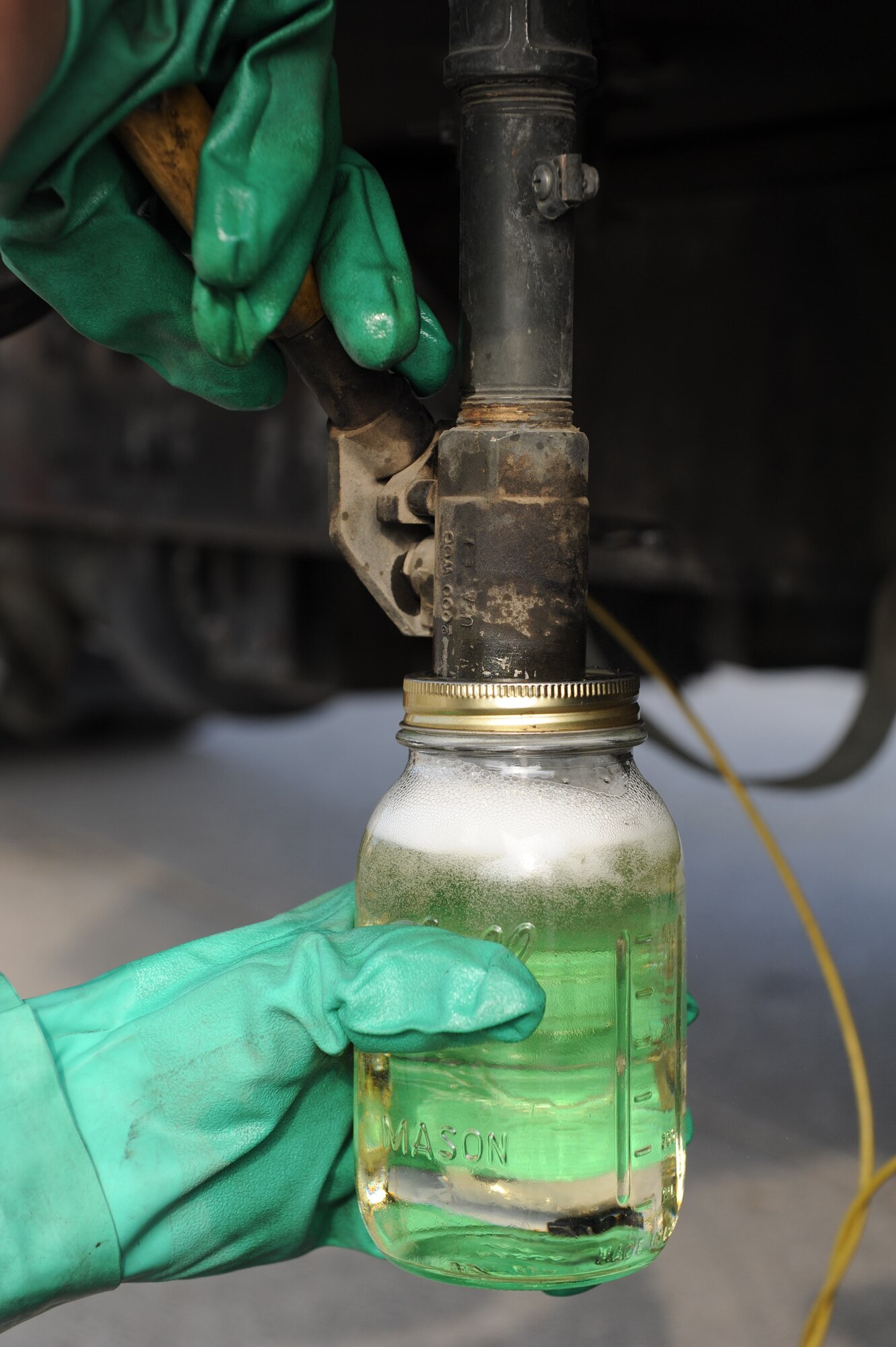 Airman 1st Class Ethan Retallack, 39th Logistics Readiness Squadron fuels distribution operator, checks for water in fuel tanks Aug. 2, 2012, at Incirlik Air Base, Turkey. Retallack checks the fuel in all the trucks to ensure it is usable. (U.S. Air Force photo by Senior Airman Anthony Sanchelli/Released)