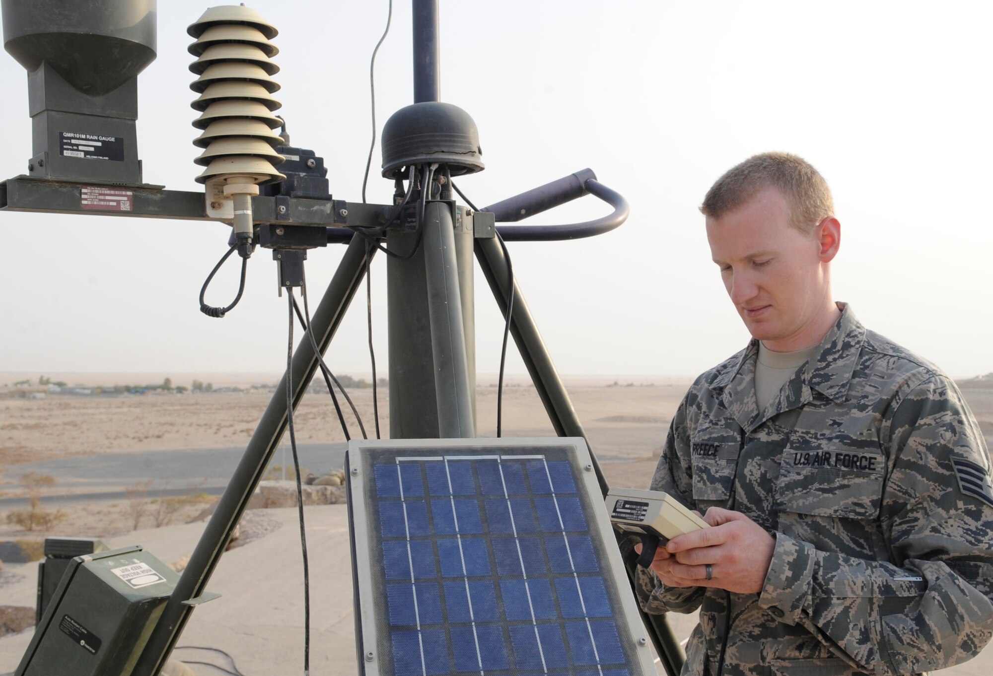 SOUTHWEST ASIA – Staff Sgt. Cameron Preece, 386th Expeditionary Operation Support Squadron weather forecaster, studies the weather using a tactical meteorological observation system here July 31. The system is a field-deployable, compact weather station for various field operations. Offering broad sensor capability, the portable system can be easily  and rapidly deployed. The weather flight provides accurate and timely weather to deployed U.S. Army and Air Force units for planning and mission completion. Preece is the 386th Air Expeditionary Wing’s Rock Solid Warrior.  (U.S. Air Force photo/Staff Sgt. Alexandra M. Boutte)