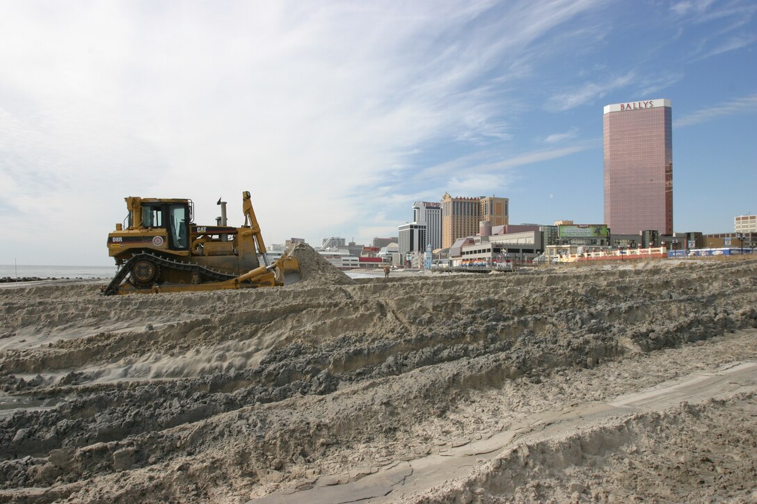 Bulldozers push sand during the initial construction of the storm damage reduction project at Atlantic City and Ventnor in 2004. 