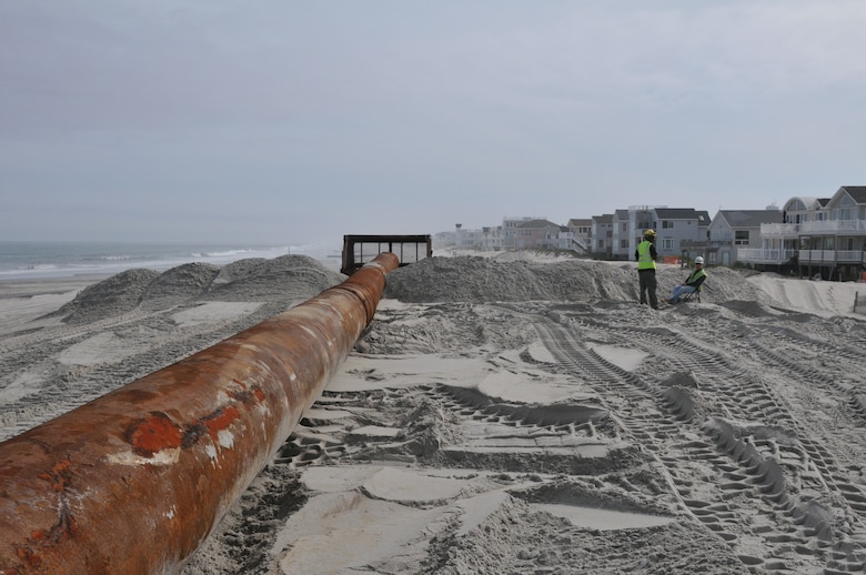 The Army Corps of Engineers Philadelphia pumps sand from an offshore borrow through pipe onto Brant Beach. The work is designed to reduce storm damages to the community and infrastructure. 