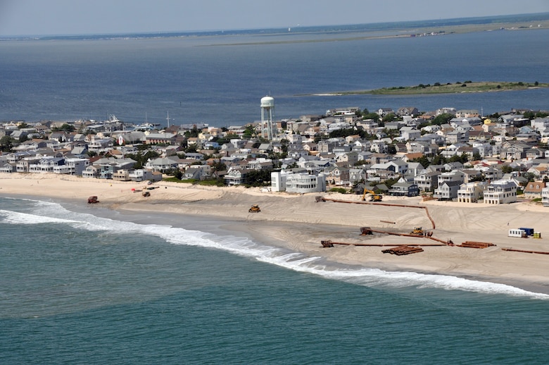 An aerial photograph captures contractors completing the Brant Beach storm damage reduction project in 2012. The beachfill work is designed to reduce storm damages to the community and infrastructure. 