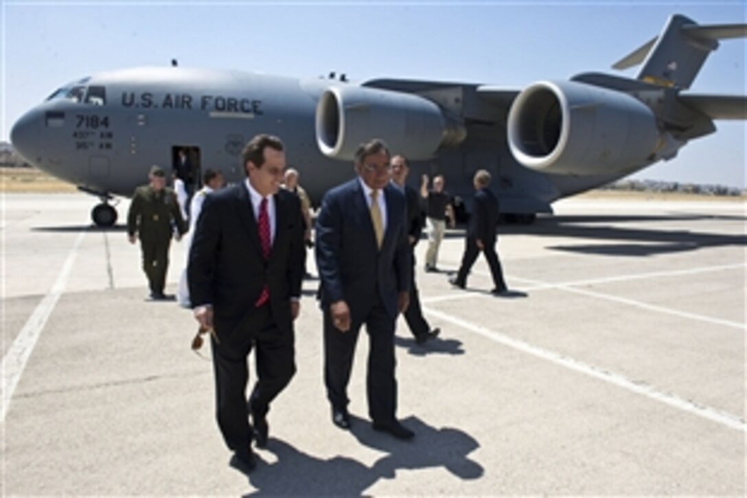 U.S. Defense Secretary Leon E. Panetta walks with U.S. Ambassador to Jordan Stuart E. Jones upon his arrival in Amman, Jordan, Aug. 2, 2012. Panetta is on a five-day trip to the region to meet with leaders in Tunisia, Egypt, Israel and Jordan.