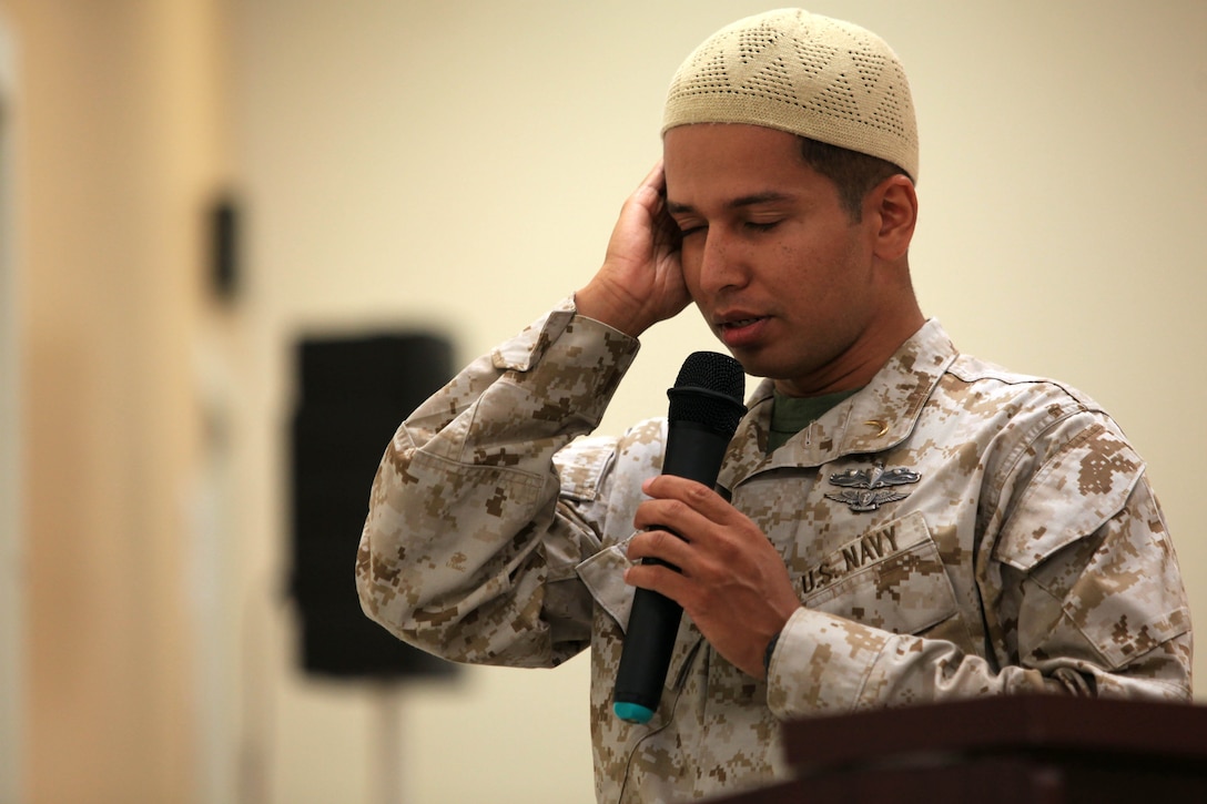 U.S. Navy Lt. Asif I. Balbale, chaplain for the Assault Amphibian School Battalion, Marine Corps Base Camp Pendleton, recites the Adhan, or call to prayer, during Iftar at the Blinder Memorial Chapel, Aug. 2.  Iftar allows fasting Muslims to break fast with an evening meal that takes place at sunset each night during the Islamic holy month of Ramadan