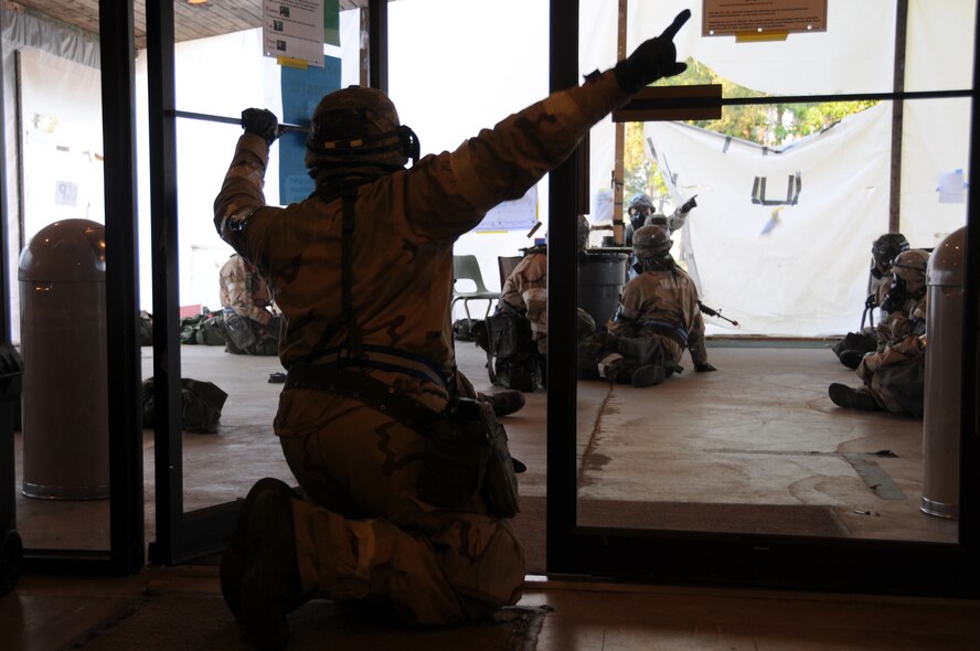 ALPENA COMBAT READINESS TRAINING CENTER, Mich. – An Airman of the 125th Air Expeditionary Wing (deployed) yells a “SALUTE” report to his Unit Control Center during an Operational Readiness Inspection here July 22, 2012.  SALUTE stands for size, activity, location, unit, time and equipment. The SALUTE report is used to report suspicious activity to the Emergency Operations Center. (U.S. Air Force photo by Senior Airman Jessica Mae Snow)