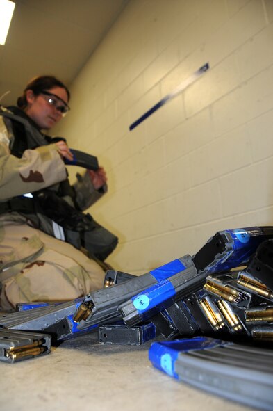ALPENA COMBAT READINESS TRAINING CENTER, Mich. – Senior Airman Samantha Vice, 914th Logistics Readiness Squadron, organizes M-16 magazines during an Operational Readiness Inspection here July 22, 2012.  The magazines are kept in order by number so that there is always accountability for ammunition. (U.S. Air Force photo by Senior Airman Jessica Mae Snow)