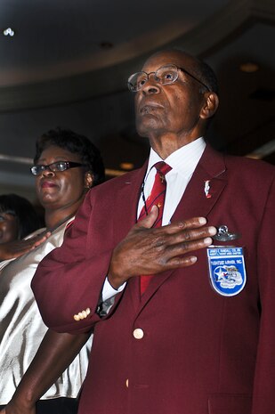 Retired Col. and Tuskegee Airman James E.  Randall renders respects as the national anthem is sung during a youth lunch Aug. 2, 2012 in downtown Las Vegas, Nev. The lunch took place during the 41st Annual Tuskegee Airmen, Inc. National Convention. (U.S. Air Force photo by Senior Airman Jack Sanders)