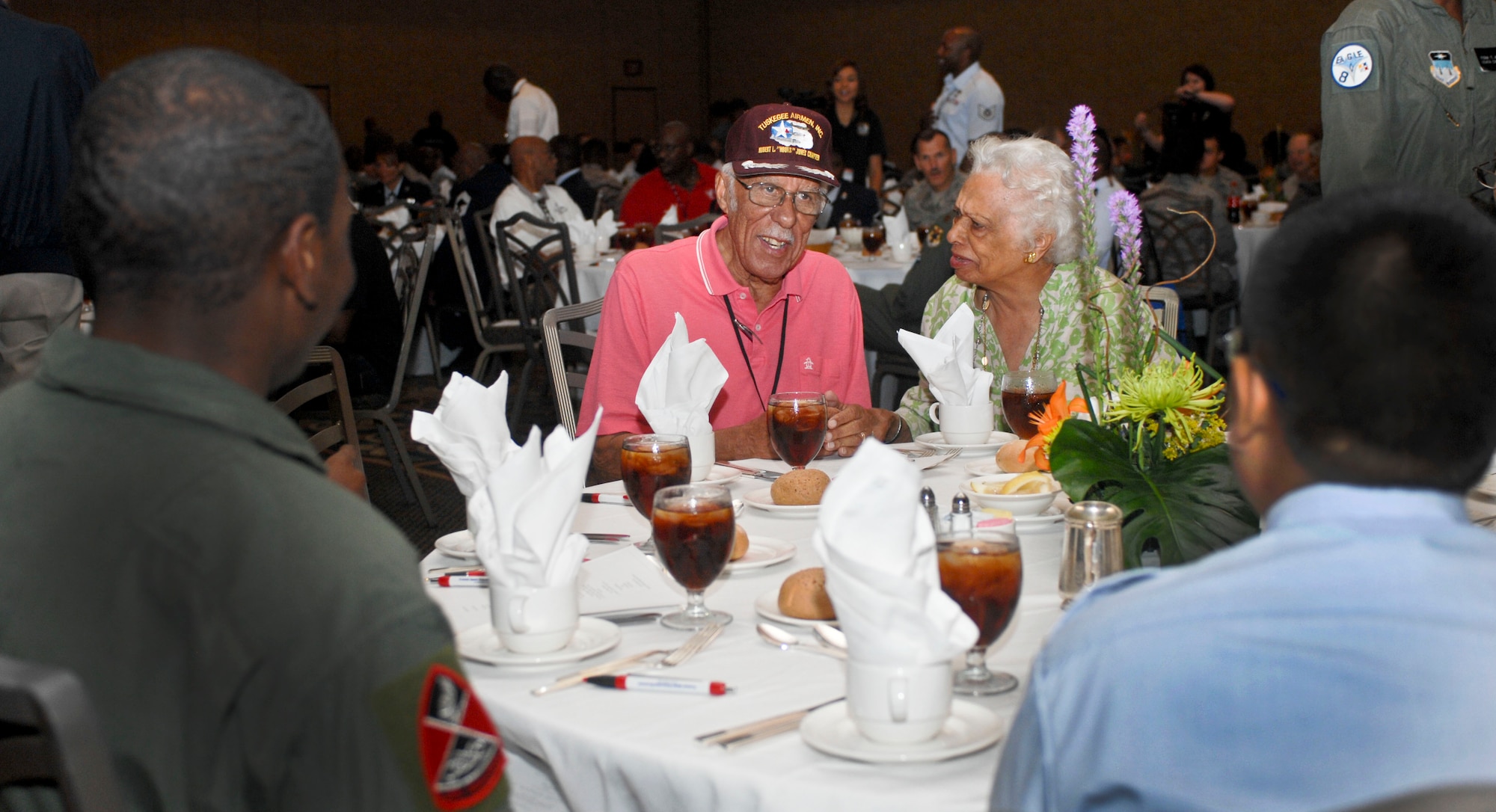 Retired Capt. Samuel Hunter Jr. speaks with a group of people at a youth lunch Aug. 2, 2012 in downtown Las Vegas, Nev. during the 41st Annual Tuskegee Airmen, Inc. National Convention. The youth lunch's purpose was put on to help today's youth remember their past, and allowed leaders to provide mentorship to the youth. (U.S. Air Force photo by Senior Airman Jack Sanders)
