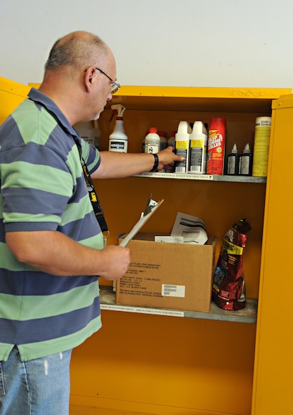 John Thompson, Hazardous Material Pharmacy site manager, conducts an inspection on a locker containing hazardous materials on Barksdale Air Force Base, La., July 31. Any yellow locker contains flammable hazmat that is subject to inspections, which ensure all hazmat is present and in good condition. (U.S. Air Force photo/Airman 1st Class Benjamin Gonsier)(RELEASED)