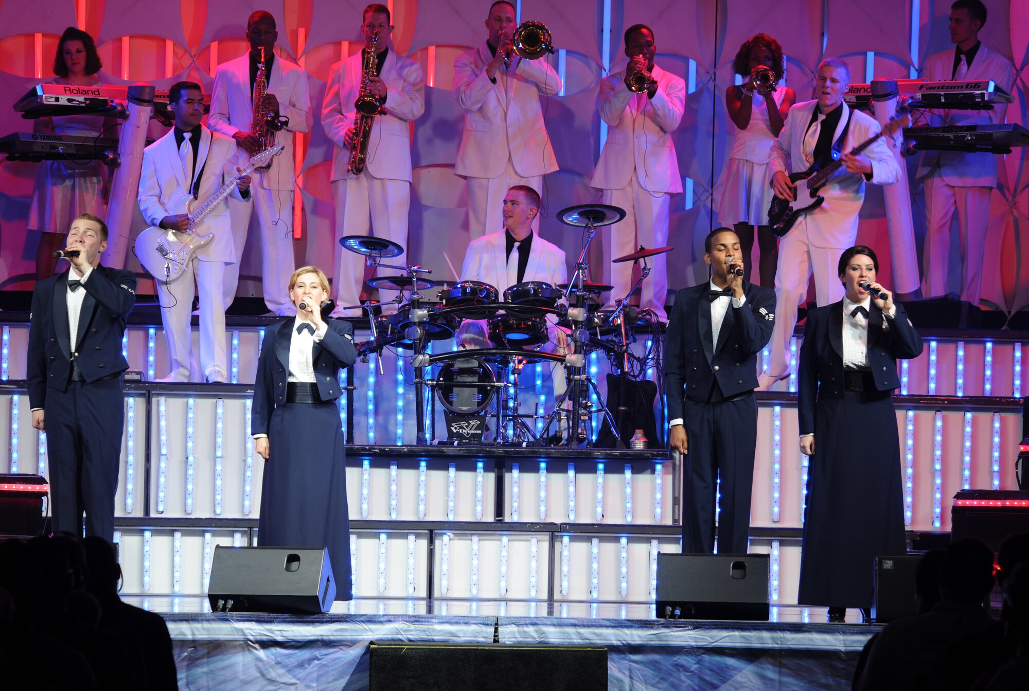 Air Force Tops in Blue performs for the Barksdale community during their 2012 world tour, "Listen", at Hoban Hall on Barksdale Air Force Base, La., Aug. 2. Their world tour invites the audience to listen to the music of life through the sounds Airmen hear every day. (U.S. Air Force photo/Airman 1st Class Benjamin Gonsier)(RELEASED)

