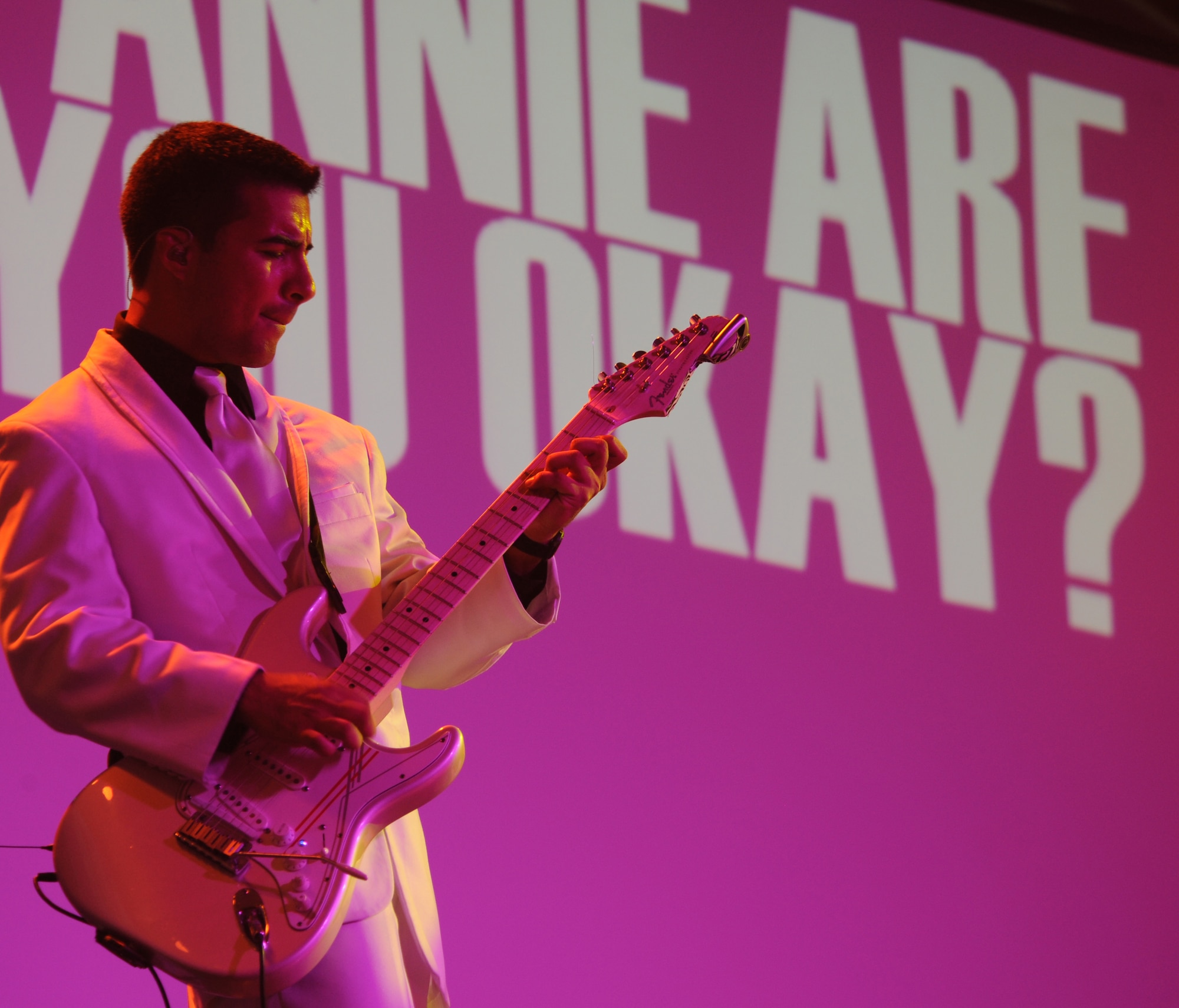 Senior Airman Kenneth Del Valle Ruiz, Tops in Blue guitarist, plays the guitar during the Tops in Blue 2012 World Tour, "Listen", at Hoban Hall on Barksdale Air Force Base, La., Aug. 2. Tops in Blue is an active-duty unit consisting of the most talented vocalists, musicians, dancers and technicians in the Air Force. (U.S. Air Force photo/Airman 1st Class Benjamin Gonsier)(RELEASED)

