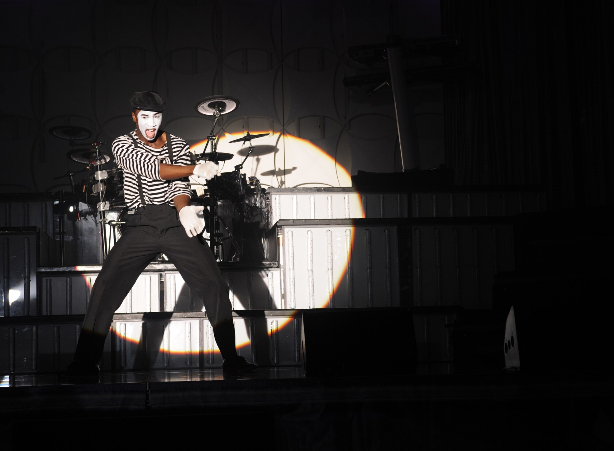Airman 1st Class Jonathan Leak, Tops in Blue vocalist, performs a mime act during the Tops in Blue 2012 World Tour, "Listen", at Hoban Hall on Barksdale Air Force Base, La., Aug. 2. Miming is a performance art that tells a story using body movements without sound from the performer. Other than dancing and singing, Tops in Blue also performs various theatric acts. (U.S. Air Force photo/Airman 1st Class Benjamin Gonsier)(RELEASED)