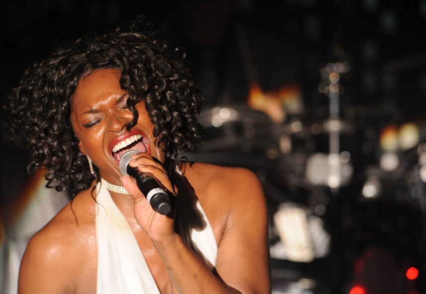 Tech. Sgt. Tonie Marshall, Tops in Blue vocalist, sings for the Barksdale community during the Tops in Blue 2012 World Tour, "Listen", at Hoban Hall on Barksdale Air Force Base, La., Aug. 2. Tops in Blue is an active-duty unit consisting of the most talented vocalists, musicians, dancers and technicians in the Air Force. (U.S. Air Force photo/Airman 1st Class Benjamin Gonsier)(RELEASED)
