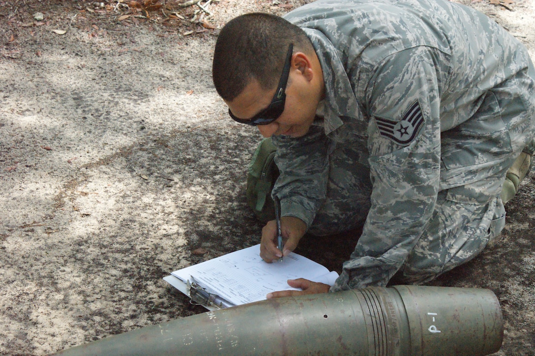 Staff Sgt. Ricardo Porto, NAVSCOLEOD student, conducts a reconnaissance training problem during Core Division training Jul. 19, 2012, at Eglin Air Force Base, Fla.  Students must pass all nine divisions of the EOD basic course before earning their "crab" . (U.S. Air Force photo/Dan Hawkins)