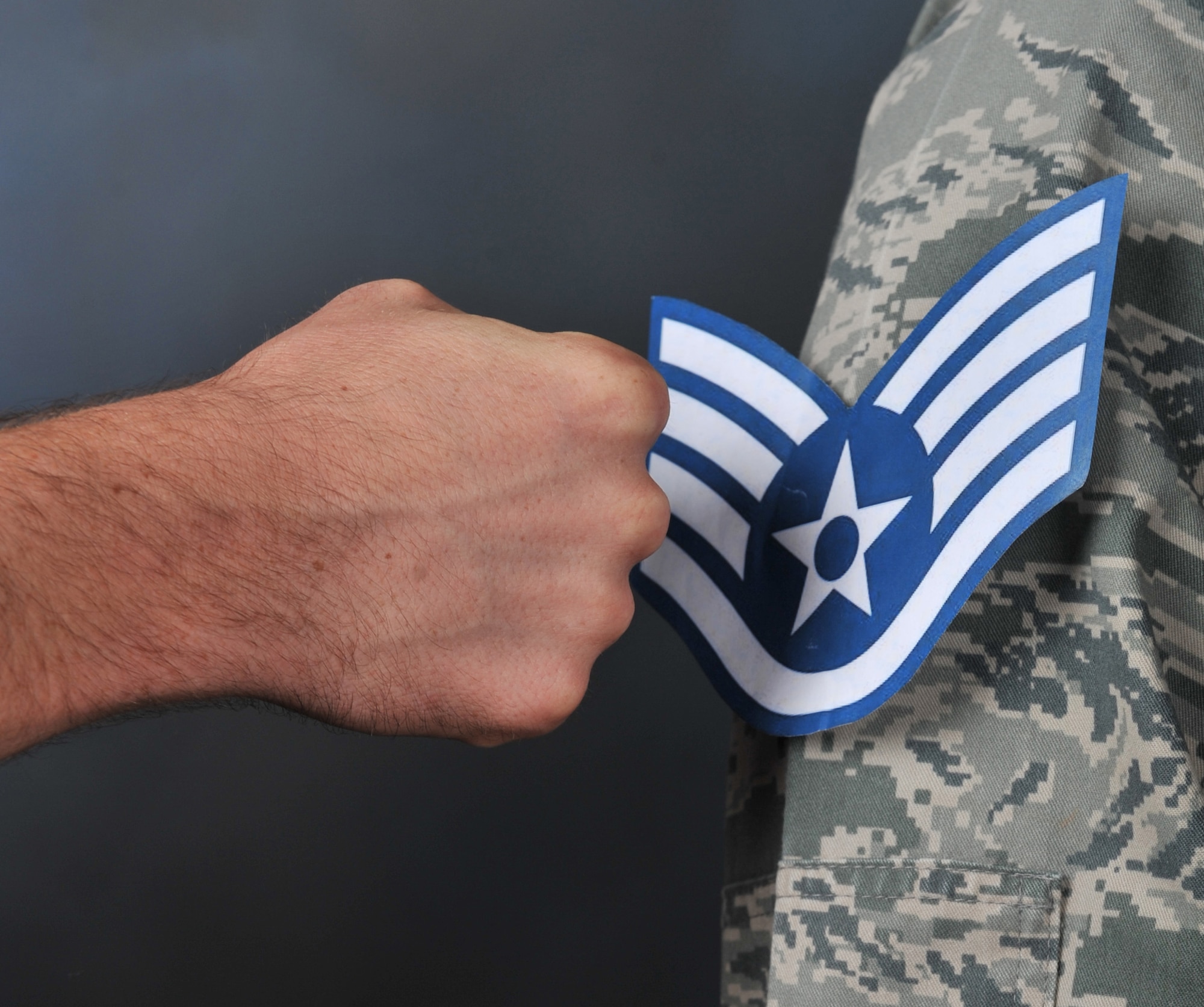 The rank of Staff Sergeant is pinned on a Senior Airman selected for promotion on Barksdale Air Force Base, La., Aug. 2. Of the 13,448 Senior Airmen who were selected for promotion to Staff Sergeant by Air Force officials, 247 were from Barksdale. (U.S. Air Force photo/Airman 1st Class Benjamin Gonsier)(RELEASED)
