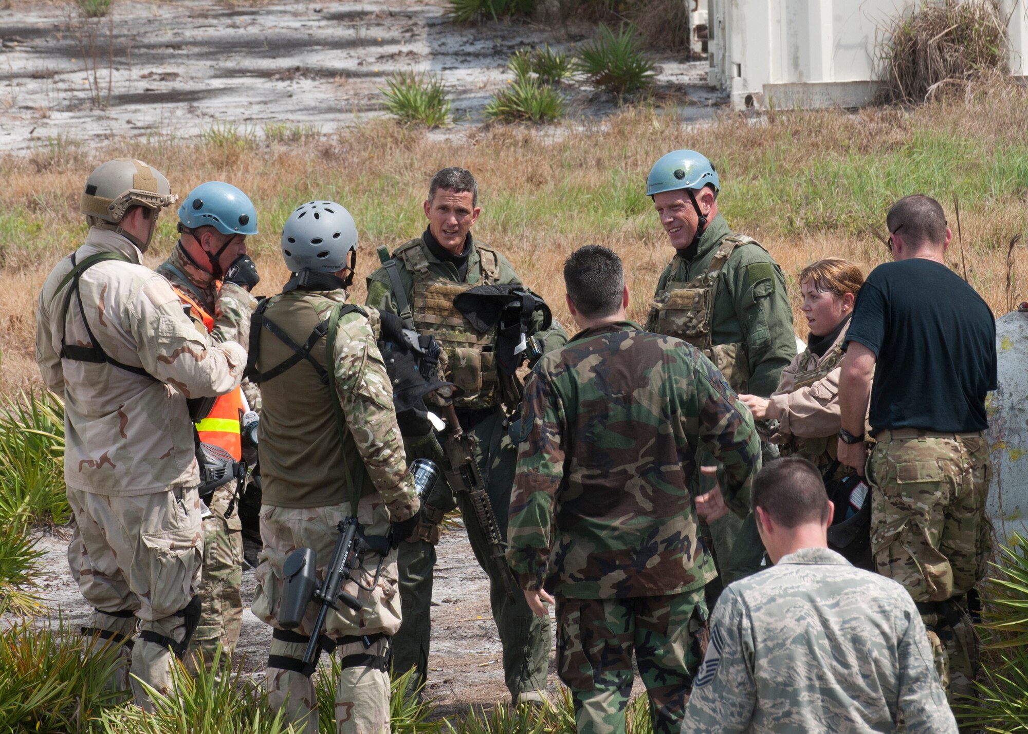 U.S. Air Force Chief Master Sgt. Rick Parsons, command chief of Air Combat Command, participates in Survival, Evasion, Resistance and Escape training with Airmen from the 347th Operations Support Squadron using simulation rounds at the Grand Bay Bombing and Gunnery Range during his visit Aug. 1, 2012, at Moody Air Force Base, Ga. Parsons also spoke at an all-call briefing to answer any questions Airmen had about budget cuts and to improve morale. (U.S. Air Force courtesy photo/Released)