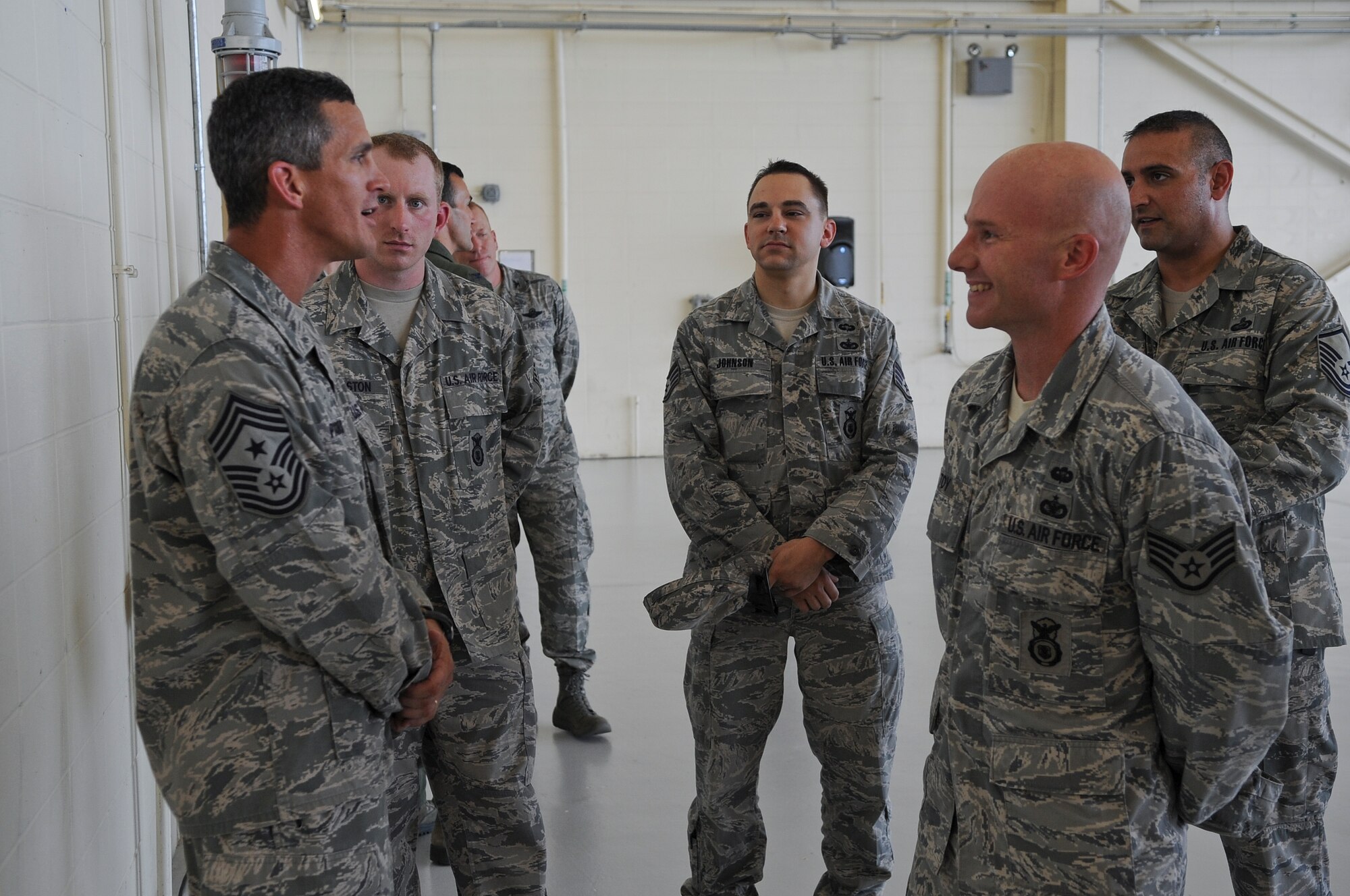 U.S. Air Force Chief Master Sgt. Rick Parsons, command chief of Air Combat Command, speaks to Staff Sgt. Richard Toy, 820th Base Defense Group, after an all-call held at Moody Air Force Base, Ga., Aug. 2, 2012. Parsons visited Moody to meet with Airmen and see improvements the base has made since his time as the 23d Wing command chief. (U.S. Air Force photo by Airman 1st Class Olivia Dominique/Released)