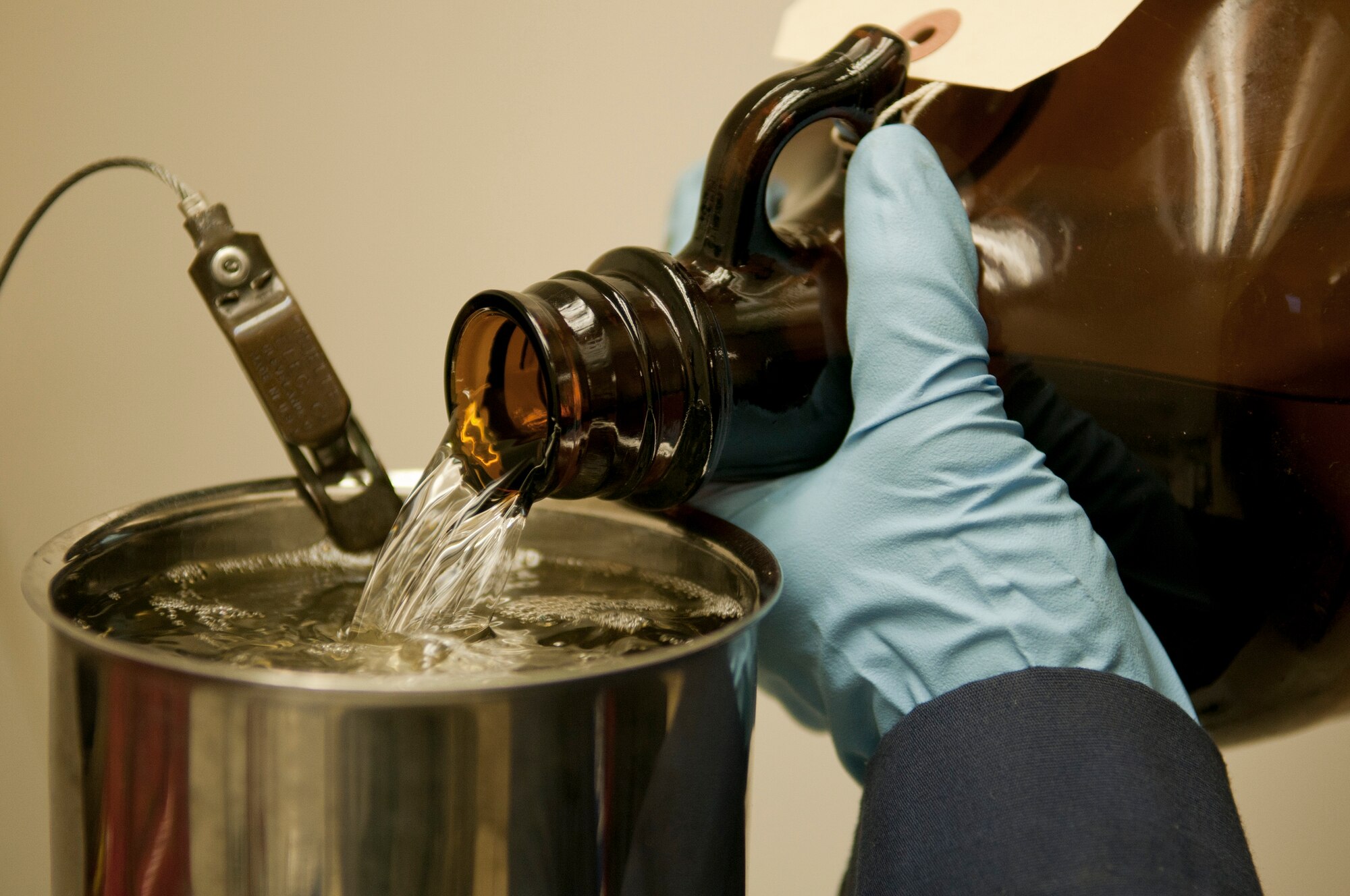 Dana Vuong, U.S. Naval Supply Fleet Logistic Center Pearl Harbor fuels department laboratory technician, sampling fuel during a bottle method test analysis July 27 to test for solids content in the fuel. The Airmen and Navy civilians operating the U.S. Naval Supply Fleet Logistic Center Pearl Harbor fuels department on Hickam Field pumped more than 10 million gallons of fuel to support air operations for RIMPAC. Twenty-two nations, more than 40 ships and submarines, more than 200 aircraft and 25,000 personnel are participating in RIMPAC exercise from Jun. 29 to Aug. 3, in and around the Hawaiian Islands. The world's largest international maritime exercise, RIMPAC provides a unique training opportunity that helps participants foster and sustain the cooperative relationships that are critical to ensuring the safety of sea lanes and security on the world's oceans. RIMPAC 2012 is the 23rd exercise in the series that began in 1971. (U.S. Air Force photo/Staff Sgt. Mike Meares)