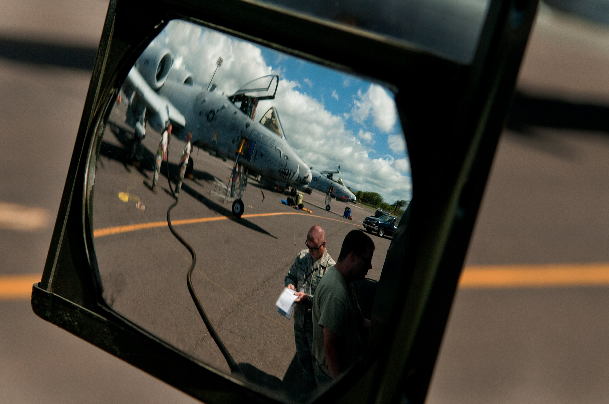 Master Sgt. Tony Karpenko, U.S. Naval Supply Fleet Logistic Center Pearl Harbor fuels department quality control inspector on Hickam Field, oversees Senior Airman Eric Smith, 307th Logistics Readiness Squadron, Barksdale Air Force Base, La., while refueling an A-10 Thunderbolt II July 25. The Airmen operating the U.S. Naval Supply Fleet Logistic Center Pearl Harbor fuels department on Hickam Field pumped more than 10 million gallons of fuel to support air operations for RIMPAC. Twenty-two nations, more than 40 ships and submarines, more than 200 aircraft and 25,000 personnel are participating in RIMPAC exercise from Jun. 29 to Aug. 3, in and around the Hawaiian Islands. The world's largest international maritime exercise, RIMPAC provides a unique training opportunity that helps participants foster and sustain the cooperative relationships that are critical to ensuring the safety of sea lanes and security on the world's oceans. RIMPAC 2012 is the 23rd exercise in the series that began in 1971. (U.S. Air Force photo/Staff Sgt. Mike Meares)  