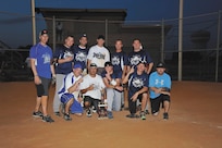 Players from the 2012 Joint Base San Antonio-Lackland intramural softball tournament champion 343rd Training Squadron display their first-place trophy after defeating the No. 1 seed, Navy Information Operations Command-Texas, July 26. (U.S. Air Force photo/Alan Boedeker)