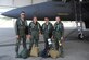 U.S. Air Force Maj. Christopher Schulz, 333rd Fighter Squadron pilot, Cadet Alana Piccone, Lt. Col. Nathaniel Hesse, 336th Fighter Squadron pilot, and Cadet Annette Eichenberger pose for a photo prior to taking-off in an F-15E Strike Eagle on Seymour Johnson Air Force Base, N.C., July 9, 2012. It is mandatory for all Air Force Academy cadets to complete a three-week program, Operation Air Force, at an installation to gain first-hand knowledge of the various career fields the operational Air Force has to offer. (U.S. Air Force photo/Staff Sgt. Chuck Broadway/Released)
