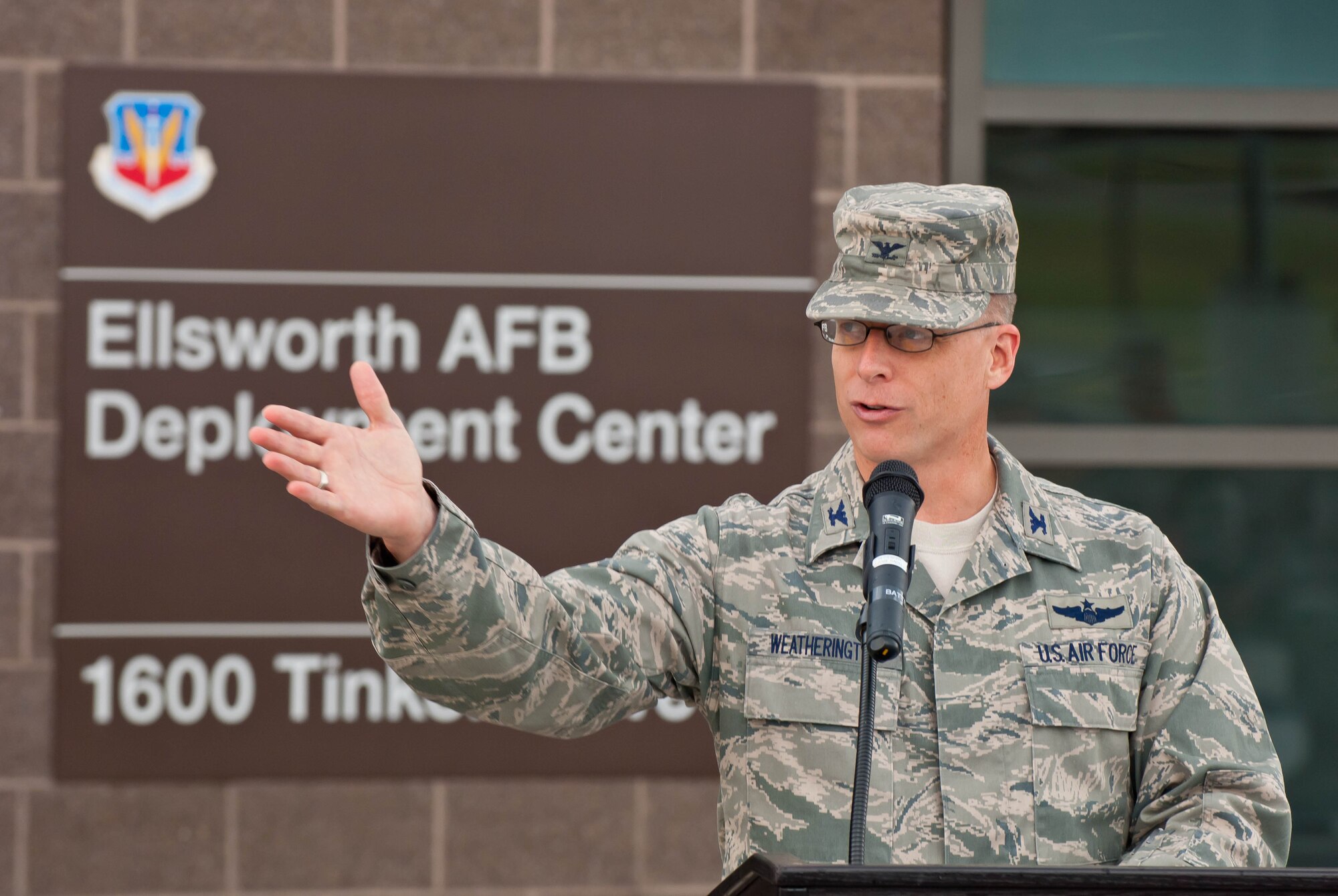 Col. Mark Weatherington, 28th Bomb Wing commander, thanks all those who worked diligently to make the new deployment center a reality during a ribbon cutting ceremony to commemorate the official opening of the facility at Ellsworth Air Force Base, S.D., Aug. 2, 2012. Construction on the new 55,000 Square foot facility began in March 2011 and was completed on May 15, 2012. (U.S. Air Force photo by Airman 1st Class Zachary Hada/Released)