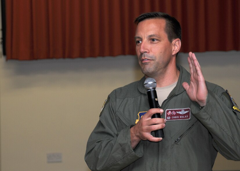 RAF MILDENHALL, England -- Col. Christopher Kulas, 100th Air Refueling Wing commander, congratulates senior airmen on their selection to staff sergeant Aug. 3, 2012, during a promotion celebration at RAF Mildenhall, England. (U.S. Air Force photo/Tech. Sgt. Neal X. Joiner)