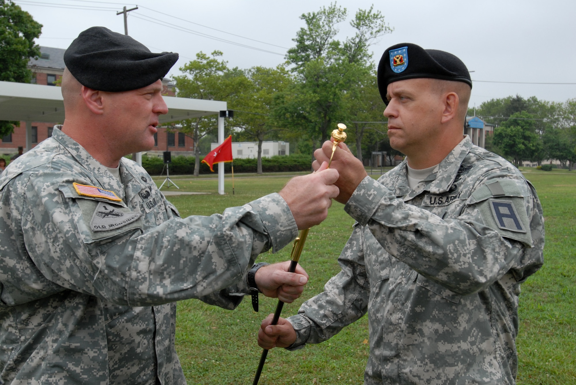 Col. Michael Shrout, 72nd Operations Brigade commander, passes the noncommissioned officers sword to Command Sergeant Maj. Berk Parsons, delegating authority and entrusting him with the responsibility and care of the brigade. The War Department adopted the unique noncommissioned officers sword, a completely functional weapon not intended for display, in 1840 but rather for hard and dedicated use. While no longer part of the Army's inventory, it remains a powerful symbol of the leadership and duty of the noncommissioned officer. Command sergeants major may come and go, but the sword remains razor sharp. (U.S. Army photo by Staff Sgt. Nicole Dykstra/Released)