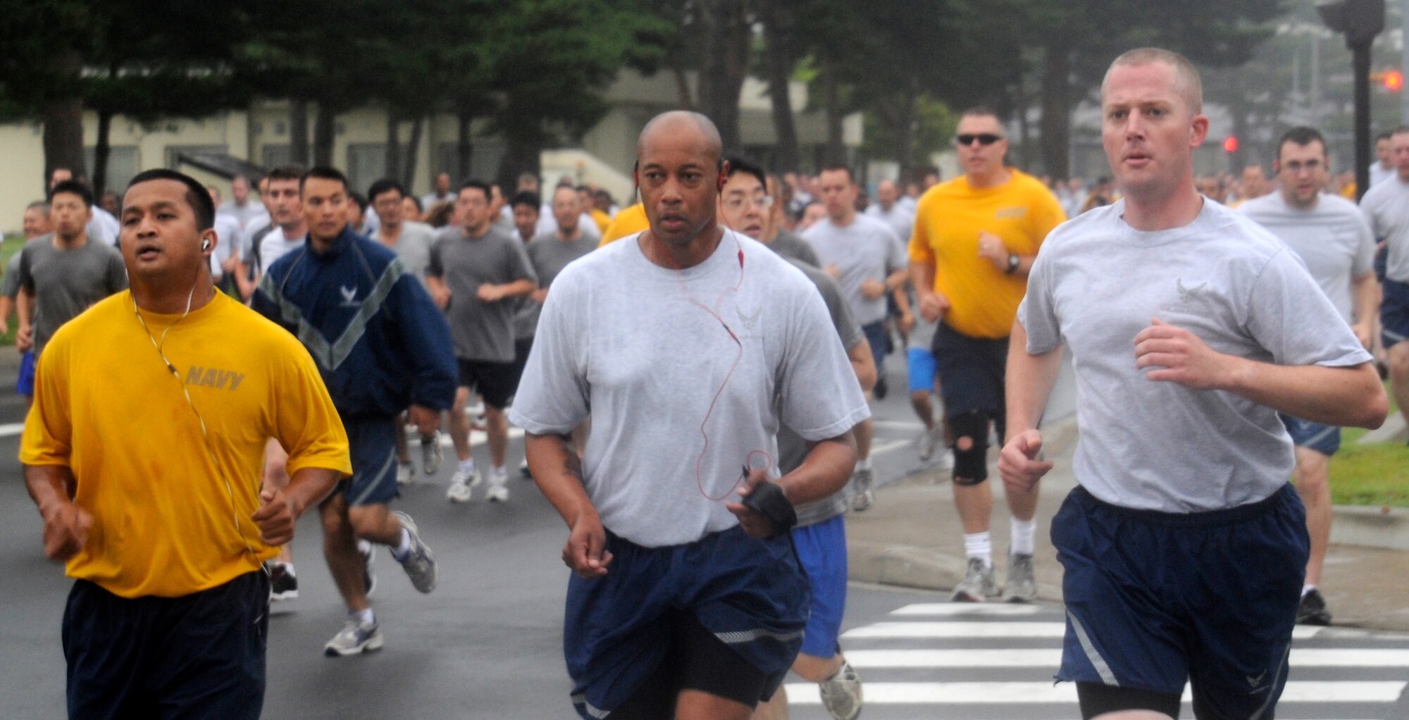 Servicemembers participate in a readiness run at Misawa Air Base, Japan, Aug. 3, 2012. Readiness runs are held every first Friday of the warmer months to promote health and fitness for all servicemembers at Misawa. (U.S. Air Force photo by Airman 1st Class Zachary Kee/Released)