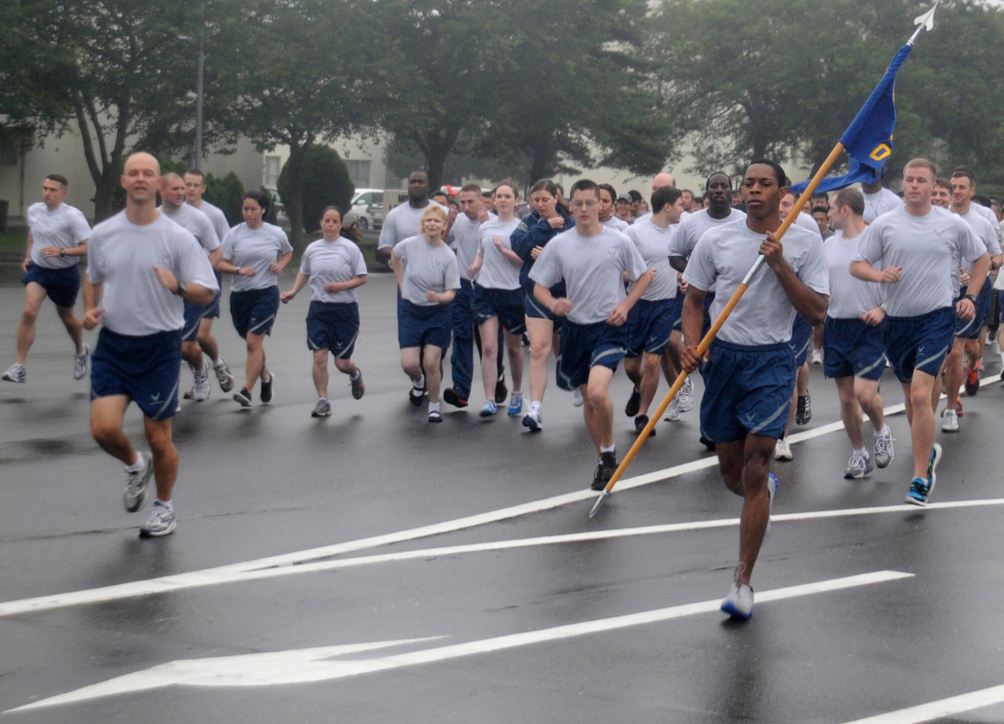 Airmen from the 35th Operations Group lead a monthly readiness run at Misawa Air Base, Japan, Aug. 3, 2012. This month’s run was hosted by the 35 OG and was held to promote fitness and raise espirit de corps throughout the base. (U.S. Air Force photo by Airman 1st Class Zachary Kee/Released)