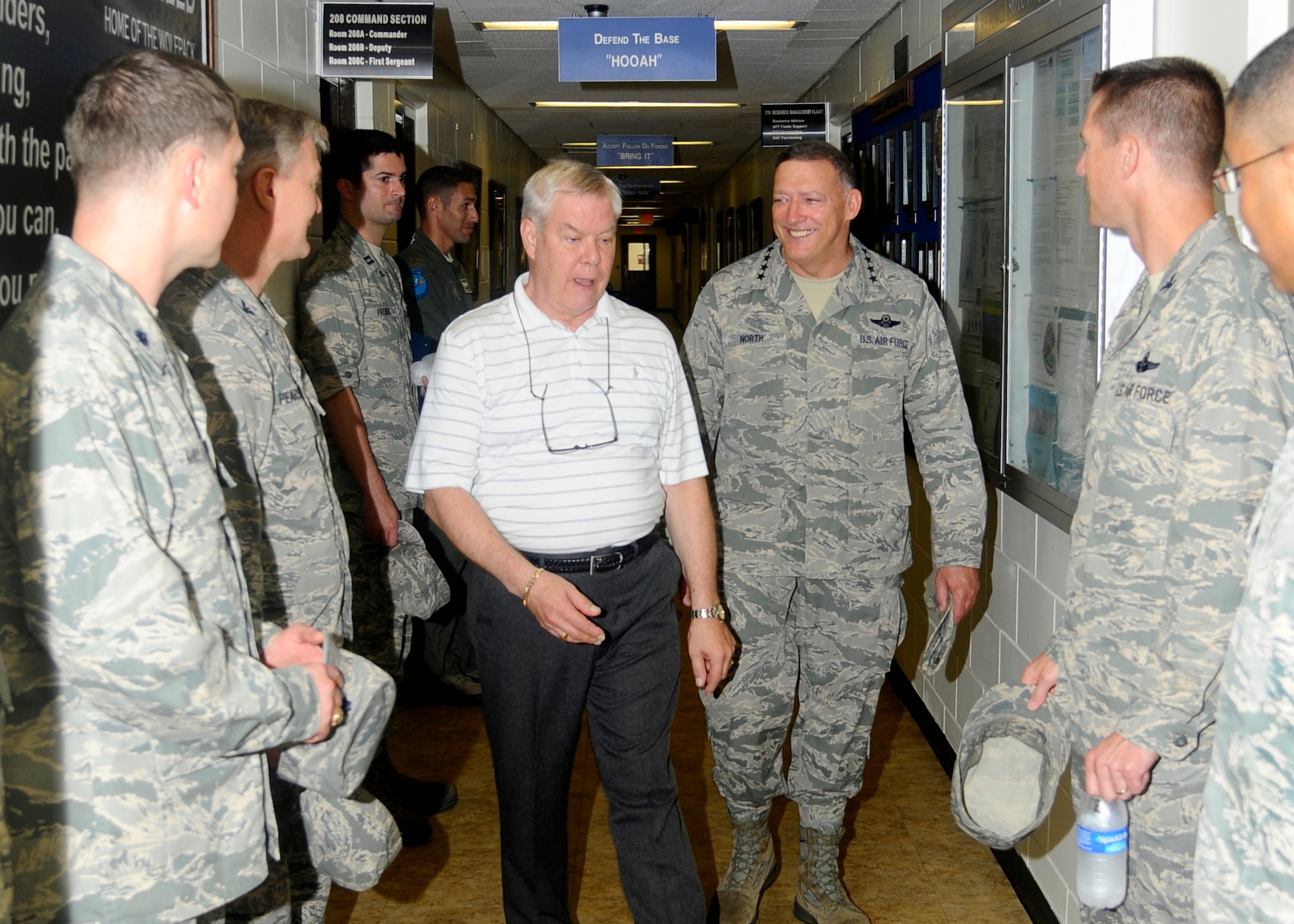 Gen. Gary North, Pacific Air Forces commander, visits the 8th Force Support Squadron as Lon Shadel, deputy commander of the 8th Force Support Squadron, shows him around at Kunsan Air Base, Republic of Korea, July 18, 2012. This was part of General North’s final tour of Kunsan before his  official retirement in October. (U.S. Air Force photo/Senior Airman Marcus Morris) 