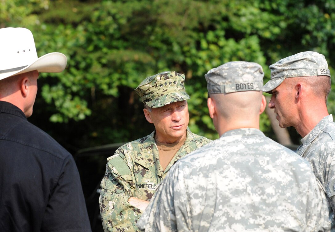 Army Lt. Col. Slade Beaudoin briefs Navy Adm. James A. Winnefeld Jr., vice chairman of the Joint Chiefs of Staff, on the partnership between his unit, the Fort Belvoir Warrior Transition Unit and the Caisson Platoon Equine Assisted Program on Fort Belvoir, Va., Aug. 2, 2012. Beaudoin commands the 1st Battalion, 3rd U.S. Infantry Regiment known as "The Old Guard."
