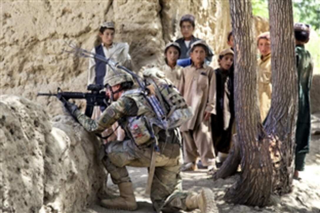 U.S. Army Pvt. Zakery Jenkins, front, provides security in Mush Kahel village in Afghanistan's Ghazni province, July 23, 2012. Jenkins is assigned to the 82nd Airborne Division's 3rd Squadron, 73rd Cavalry Regiment, 1st Brigade Combat Team.