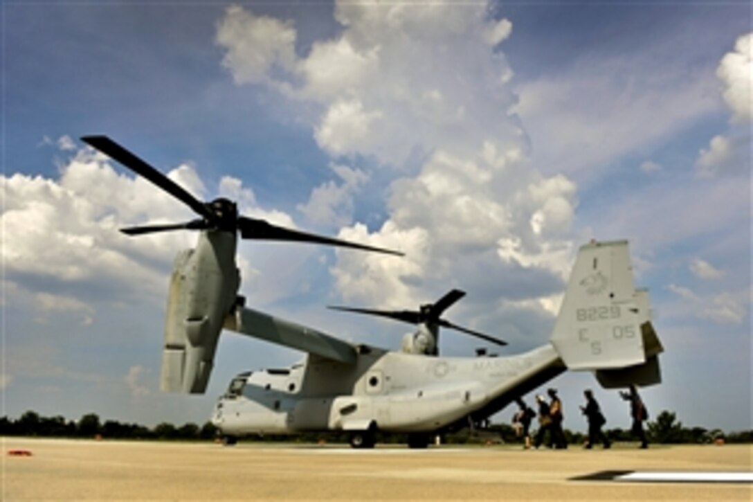 Japanese Defense Minister Satoshi Morimoto and his delegation board a V-22 Osprey to fly to Patuxent Naval Air Station from the Pentagon, Aug. 3, 2012. Morimoto met with U.S. Defense Secretary Leon E. Panetta to discuss issues of mutual concern.