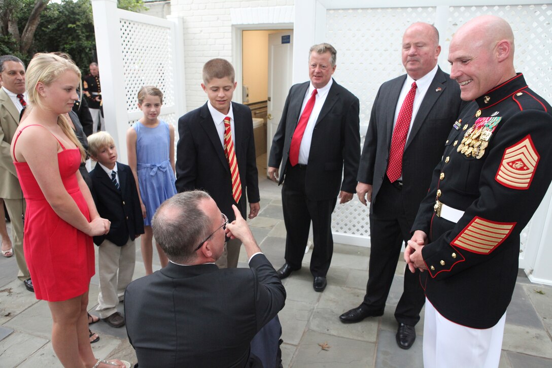 Sgt. Maj. Micheal P. Barrett, the 17th Sergeant Major of the Marine Corps, hosts the Evening Parade in honor of Dr. Rory Cooper at Marine Barracks Washington, Aug. 3, 2012.