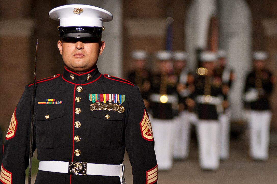 Staff Sgt. Andres De La Cueva, the parade adjutant, marches during a Friday Evening Parade at Marine Barracks Washington Aug 3.