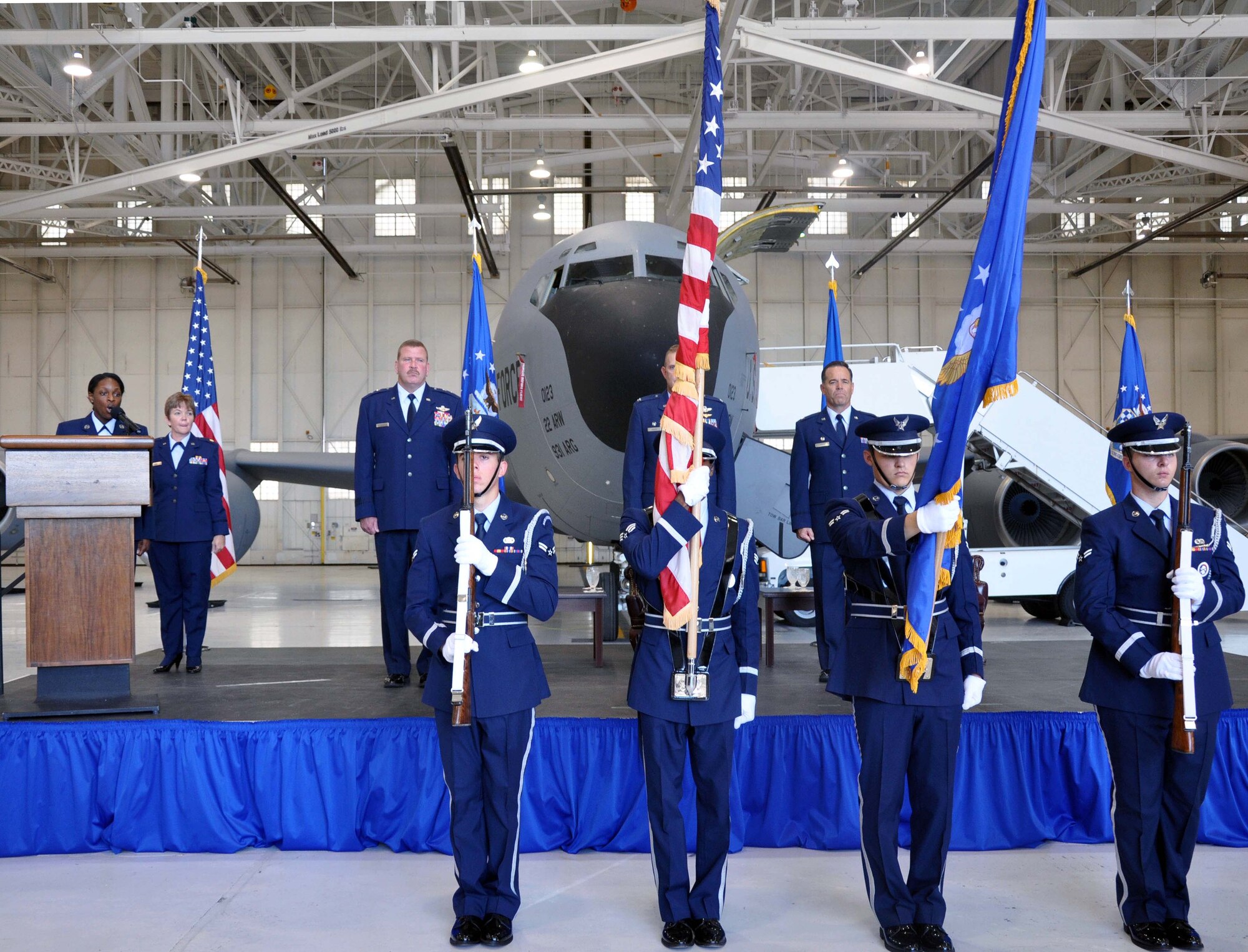 The McConnell Air Force Base Honor Guard presents the colors while Tech. Sgt. Schavonne M. Wilson, noncommissioned officer in charge, 931st Air Refueling Group chaplain's office, sings the National Anthem at the 931st Air Refueling Group change of command ceremony at McConnell Aug. 4, 2012.  Col. Mark S. Larson assumed command, replacing outgoing commander, Col. William H. Mason.  (U.S. Air Force photo by Staff Sgt. Carrie M. Peasinger)