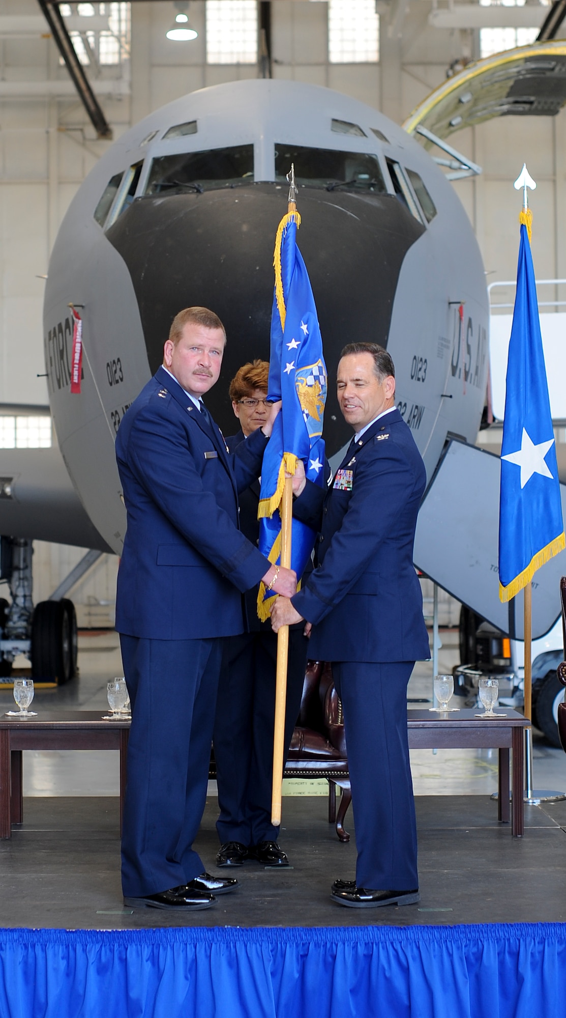Maj. Gen. Mark A. Kyle, 4th Air Force, Air Force Reserve commander, passes the 931st Air Refueling Group flag to Col. Mark S. Larson, 931st ARG commander, during a change of command ceremony August 4, 2012, McConnell Air Force Base, Kan. (U.S. Air Force photo/Airman 1st Class Jose L. Leon)
