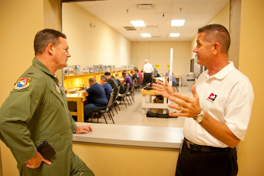 Clearwater, Fla. – Col. Dave Pavey, left, speaks with George Nelson, senior vice president of the National Aviation Academy.  The academy certifies mechanics like those in Pavey’s unit with the Federal Airline Administration.  Members of the command staff from the 927th Air Refueling Wing recently toured St. Petersburg, a community next to their native Tampa.  Other stops on the group’s tour were museums that had relevance to the wing and military history.  (Official; U.S. Air Force photo/Staff Sgt. Shawn Rhodes)    