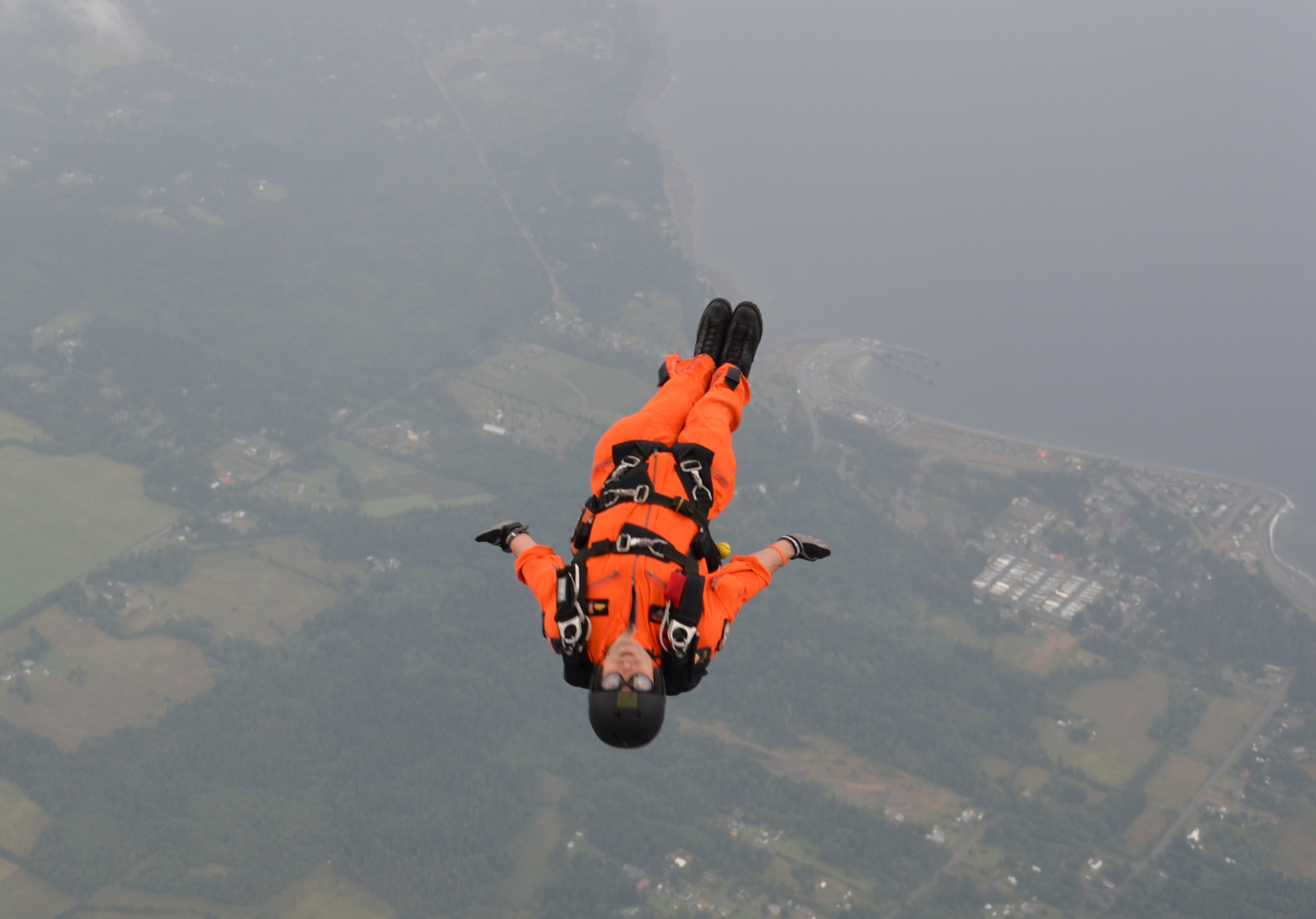 A Canadian search-and-rescue technician, or SAR Tech, does a free-fall jump from a Royal Canadian Air Force CC-115 Buffalo aircraft over Comox, Canada, July 20, 2012. The jump was part of a training exercise with pararescuemen from the 920th Rescue Wing’s 308th Rescue Squadron. (U.S. Air Force photo/Staff Sgt. Anna-Marie Wyant)