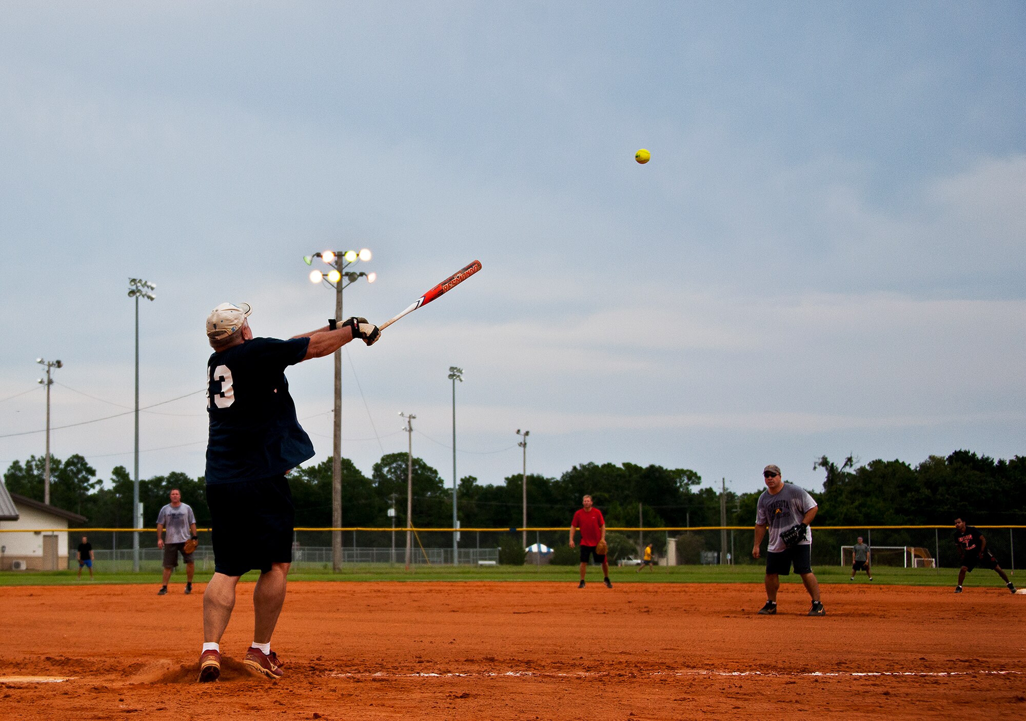 Mark Boyd, of the 96th Medical Group, swings for a base hit during the final inning of the intramural softball championship game Aug. 2 at Eglin Air Force Base, Fla.  MDG won the championship beating the Armament Directorate in final inning 7-6.  (U.S. Air Force photo/Samuel King Jr.)