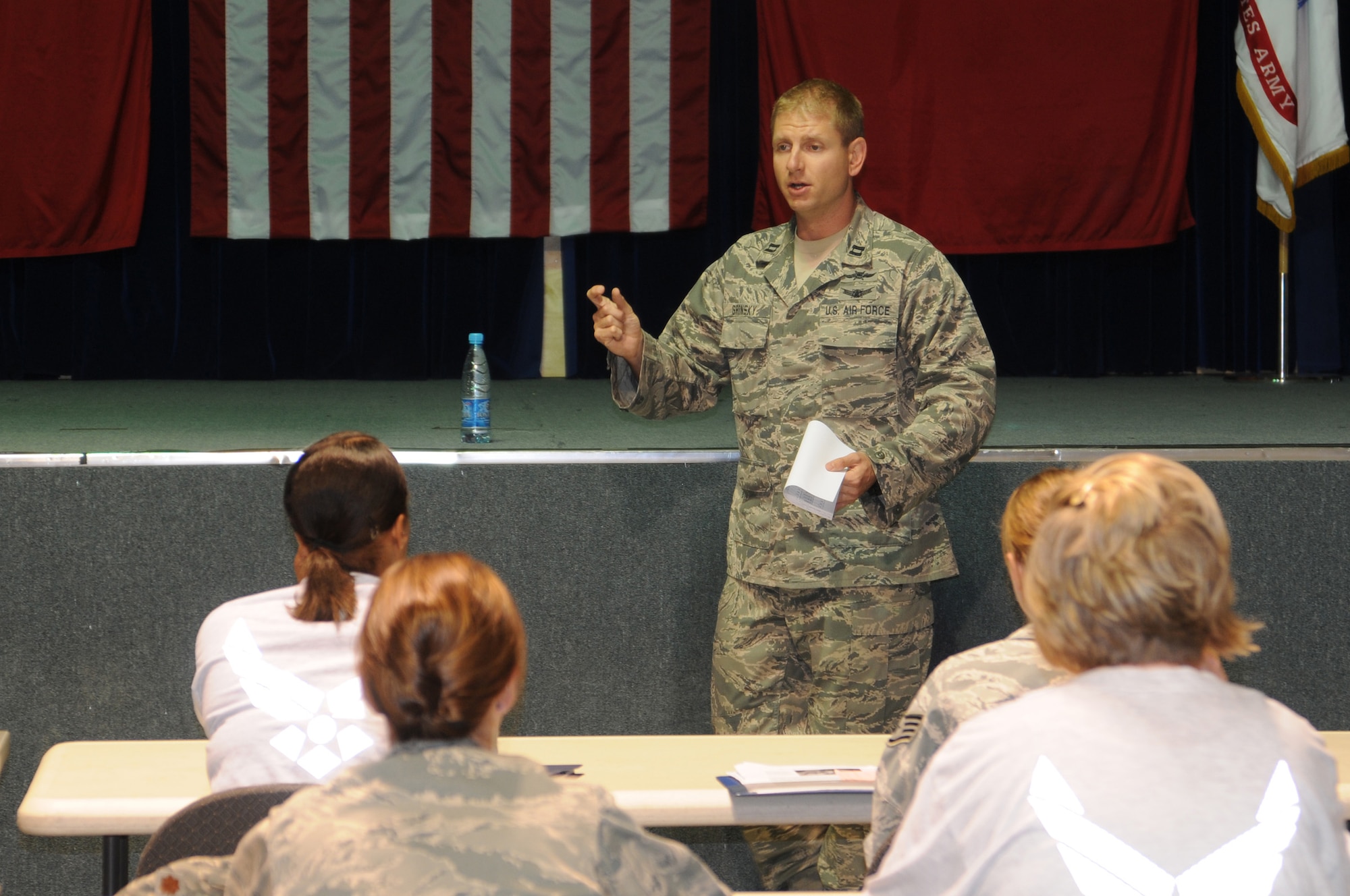 Capt. Russell Gronsky instructs service members on the basics of the Russian alphabet during a language class at the Transit Center at Manas, Kyrgyzstan, July 31, 2012. The primary objective of the familiarization course is to provide Soldiers, Sailors, Airmen and Marines with a foundation in conversational Russian and ensure enhanced communication with the people of the Kyrgyz Republic. Gronsky, who was born in Ukraine, is deployed from Buckley Air Force Base, Colo.  (U.S. Air Force photo/Staff Sgt. Matt Benedetti)      