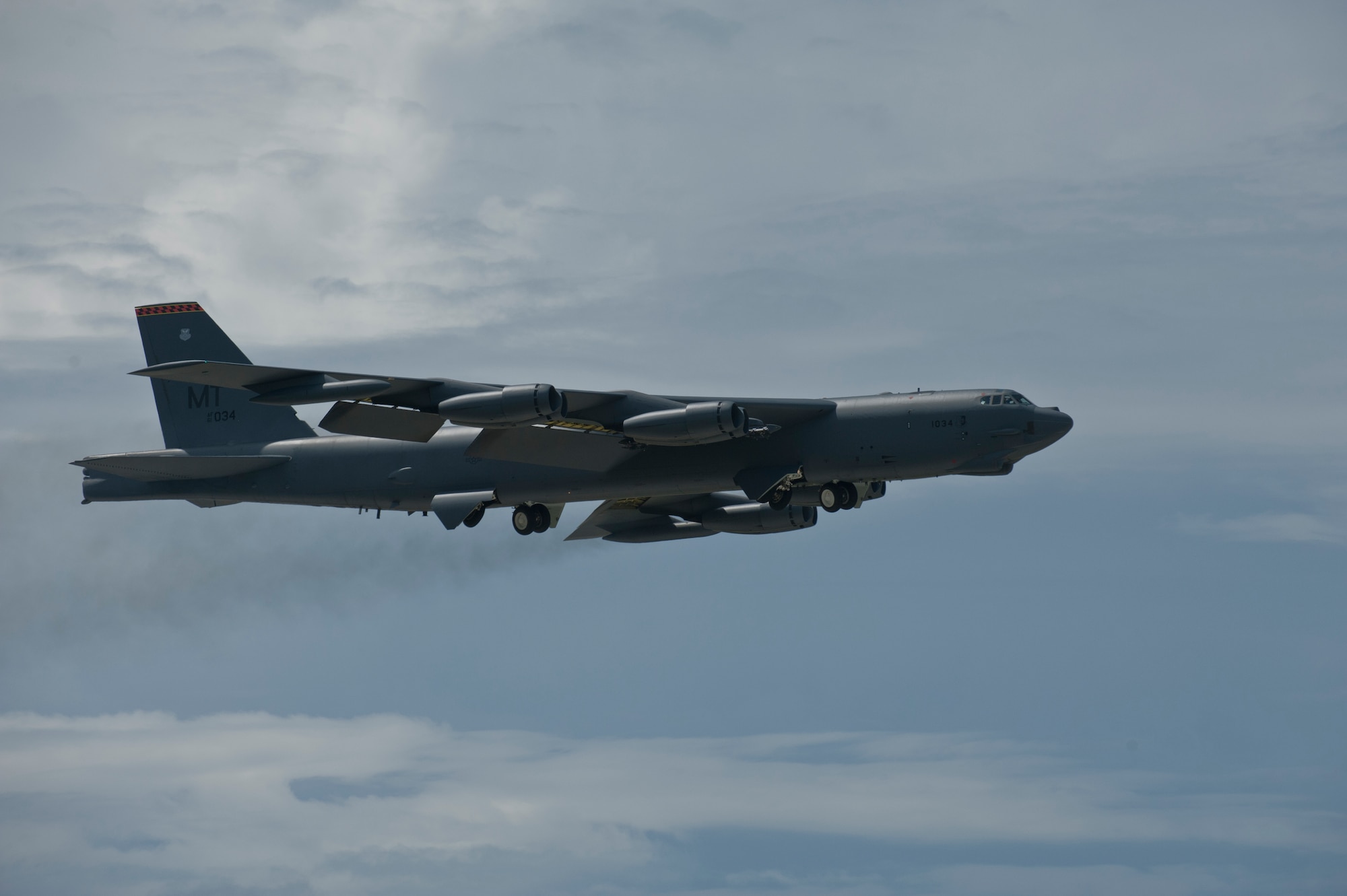 ANDERSEN AIR FORCE BASE, Guam-Members of the 69th Expeditionary Bomber Squadron, deployed in from Minot Air Force Base, North Dakota, perform pre-flight checks on a B-52 Stratofortress aircraft to participate in Exercise Pitch Black here August 2. PB 12 is a multilateral exercise conducted between the U.S. Marine Corps and Australian Defense Force, Royal Thai Armed Forces, Singapore Armed Forces, New Zealand Defense Force, Malaysian Armed Forces, French Armed Forces, British Armed Forces, Indonesian National Armed Forces and a component operating under the North Atlantic Treaty Organization in order to develop greater interoperability and a seamless response to regional crises. Greater collaboration between partner militaries strengthens regional peace, stability and prosperity.  (U.S. Air Force photo by Staff Sgt. Alexandre Montes)