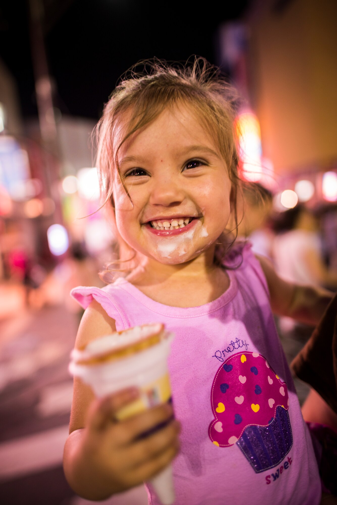 FUSSA CITY, Japan -- Mckinzie Voyles, daughter of U.S. Air Force Band of the Pacific-Asia audio engineer Staff Sgt. Joshua Voyles, smiles with an ice cream cone during the 62nd Annual Fussa Tanabata Festival in Fussa City, Japan, Aug. 2, 2012. The Tanabata Festival gave Yokota Air Base, Japan, residents a chance to experience Japanese culture with their families. This was Mckinzie's first time at a Japanese festival, and her first time having an ice cream cone. (U.S. Air Force photo by Tech. Sgt. Samuel Morse)