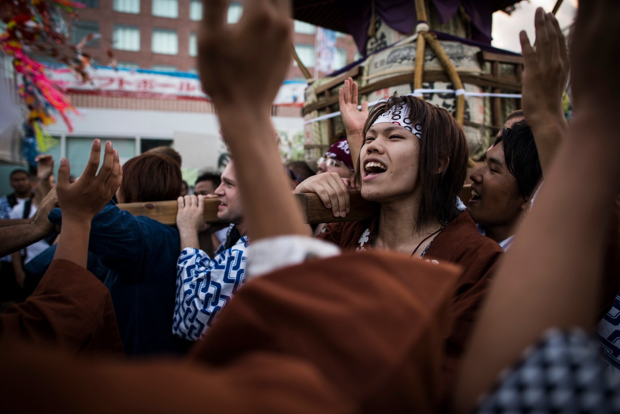 FUSSA CITY, Japan -- Japanese and American mikoshi shrine carriers chant and clap during the 62nd annual Fussa Tanabata Festival in Fussa City, Japan, Aug. 3, 2012. Known as the star festival, Tanabata celebrates the meeting of the two stars Altair and Vega, usually separated from each other by the Milky Way galaxy. (U.S. Air Force photo by Tech. Sgt. Samuel Morse)